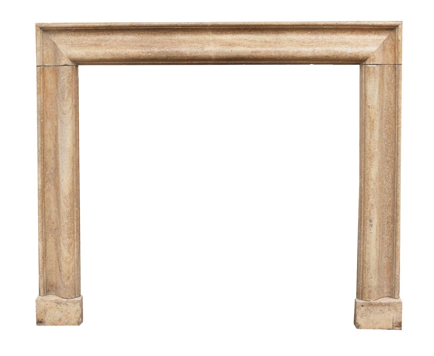 A bolection molded fireplace, hand carved from Limestone with many fossil inclusions.

Measures: Opening height 105.5 cm

Opening width 111.5 cm.