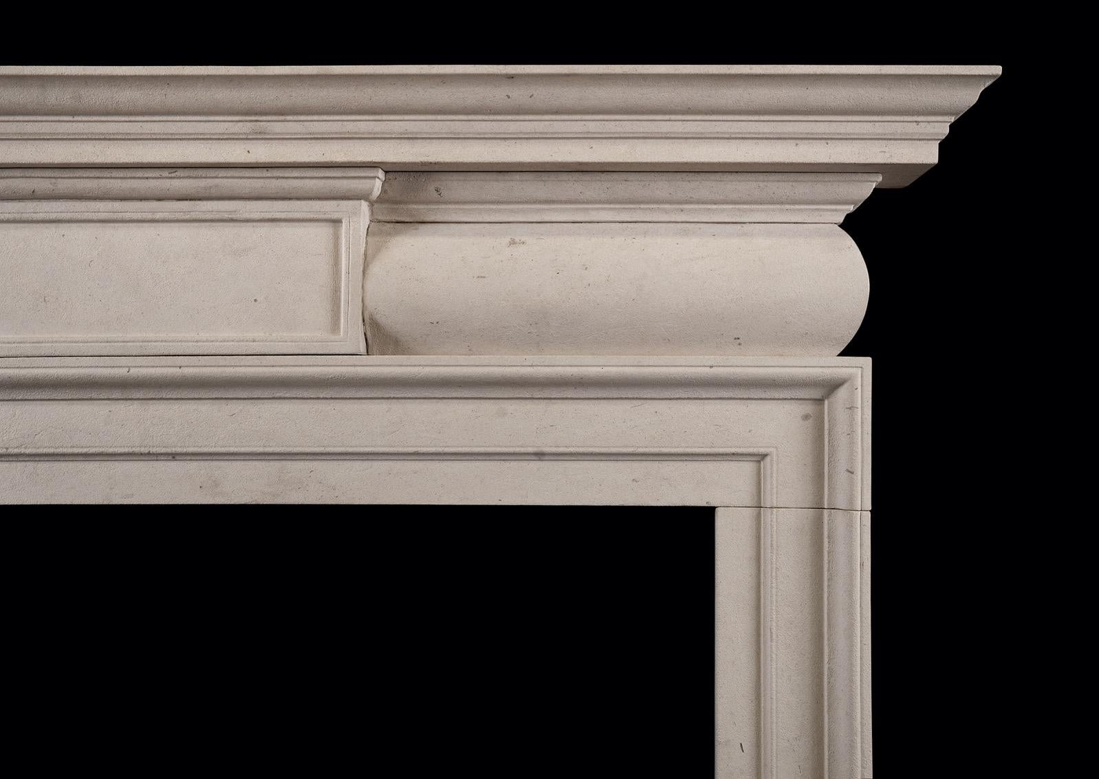 A good quality English Georgian style fireplace in Moleanos limestone. The barrel frieze with centre panel, surmounted by moulded shelf. A fine quality copy of a period piece. N.B. May be subject to an extended lead time, please enquire for more