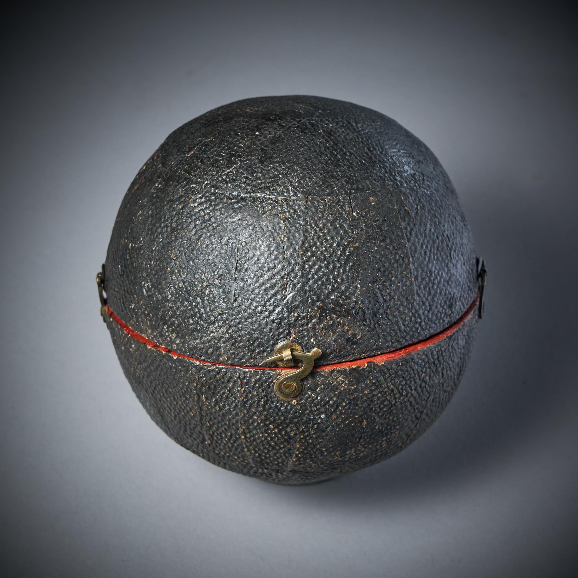 A Rare George III pocket globe by T. Harris and Son, London, 1813. Housed in the original sharkskin case.

A fasinsting and rare item in wonderful condition. 

The terrestrial globe inscribed 'New Terrestrial Globe By T.Harris and Sons 1813'