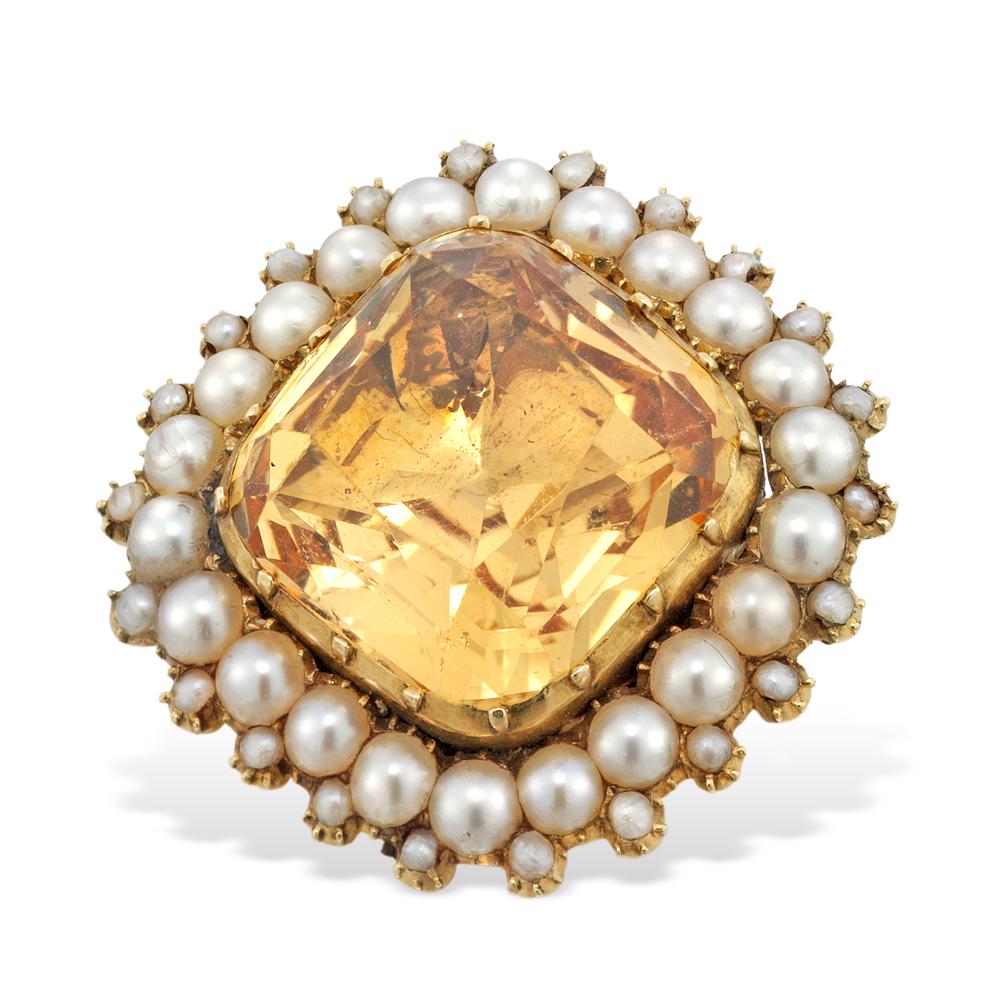 A Georgian golden topaz and pearl cluster brooch, the cushion-cut topaz measuring approximately 13 x 13 mm, yellow gold cutdown collet-set to the centre of a natural pearl cluster surround, the pearls each measuring approximately 2.5 mm in diameter,