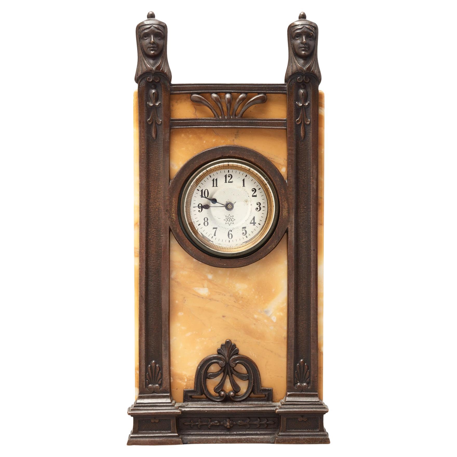A German 'Art Deco' bronze and marble clock by Junghans For Sale