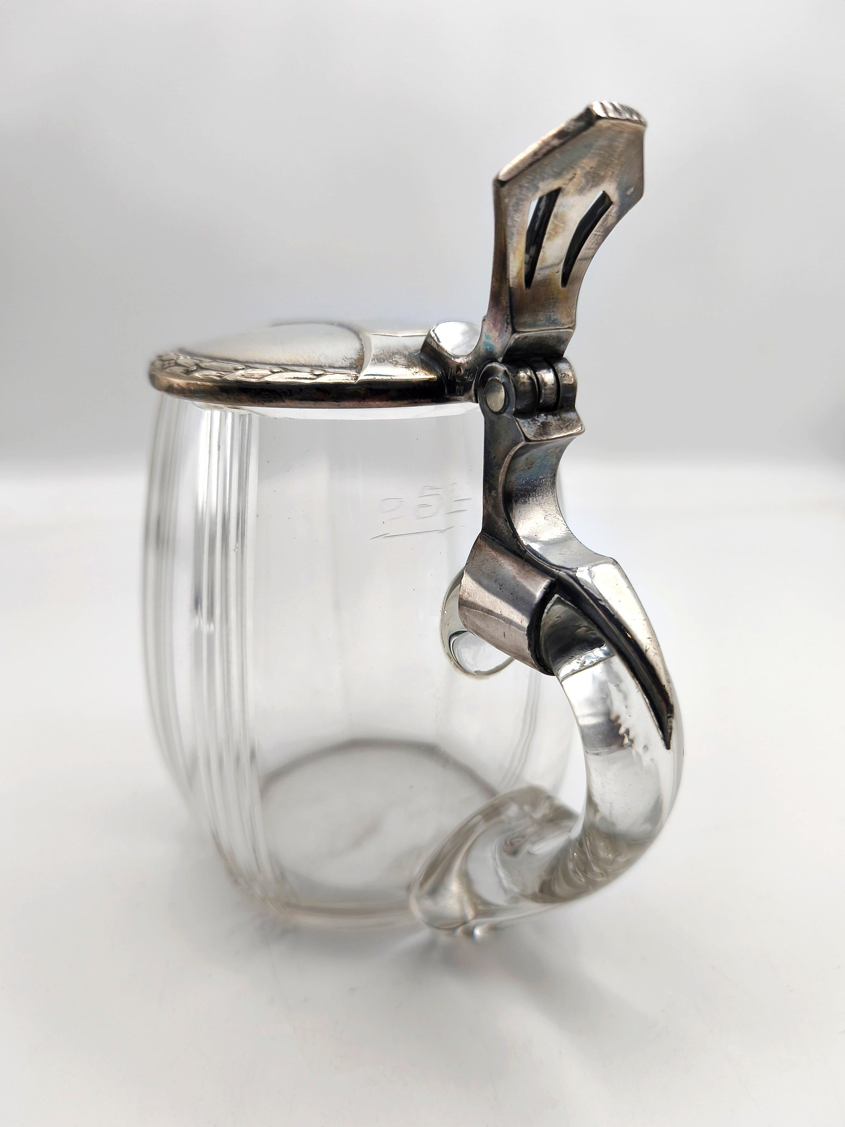 A German Jugendstil beer mug - stein - tankard - pitcher by the WMF, ca. 1910. The silver plated pewter lid decorated with ornaments of stylized blossoms.  Stamped 