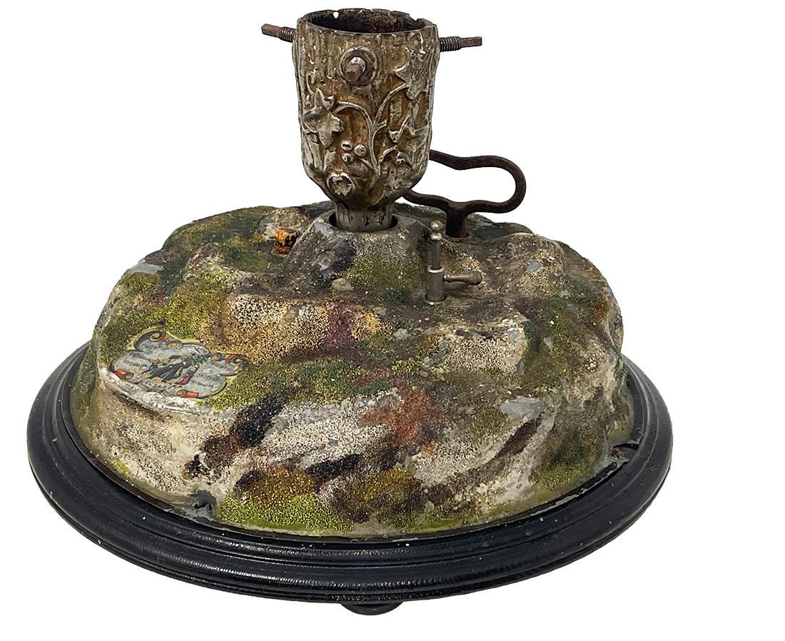 A German musical Christmas tree stand by J.C. Eckardt, 1890s

A German musical rotating Christmas tree stand. The round base, raised on four round legs of ebonized wood with pressed pewter dome and painted cast iron holder at the top with Art
