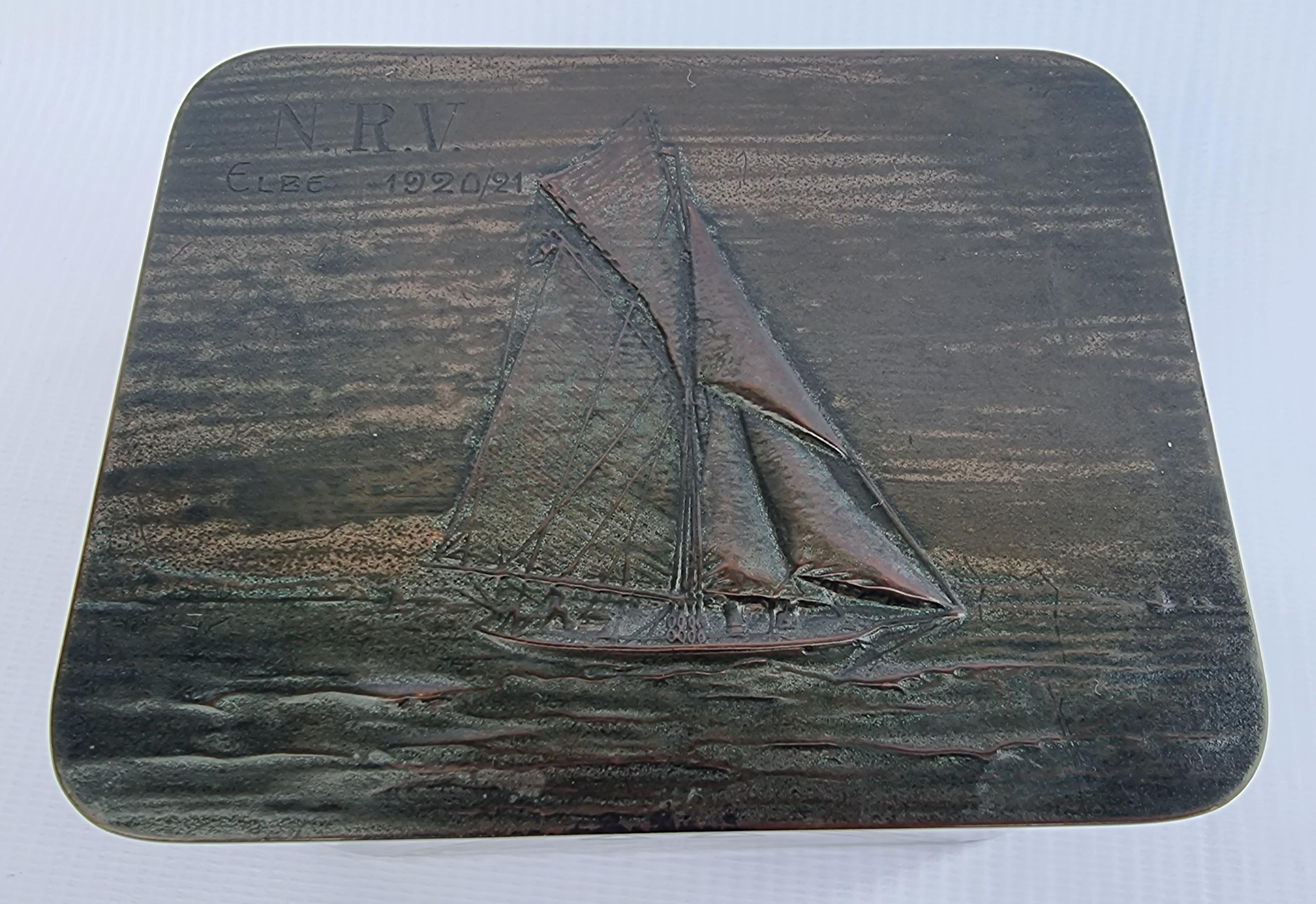 A rare early competitive sailing presentation box which is of nautical interest and made by W.M.F.

This superb W.M.F. presentation cut glass and bronze box is of nautical interest. It is a presentation piece awarded by the prestigious N.R.V. which