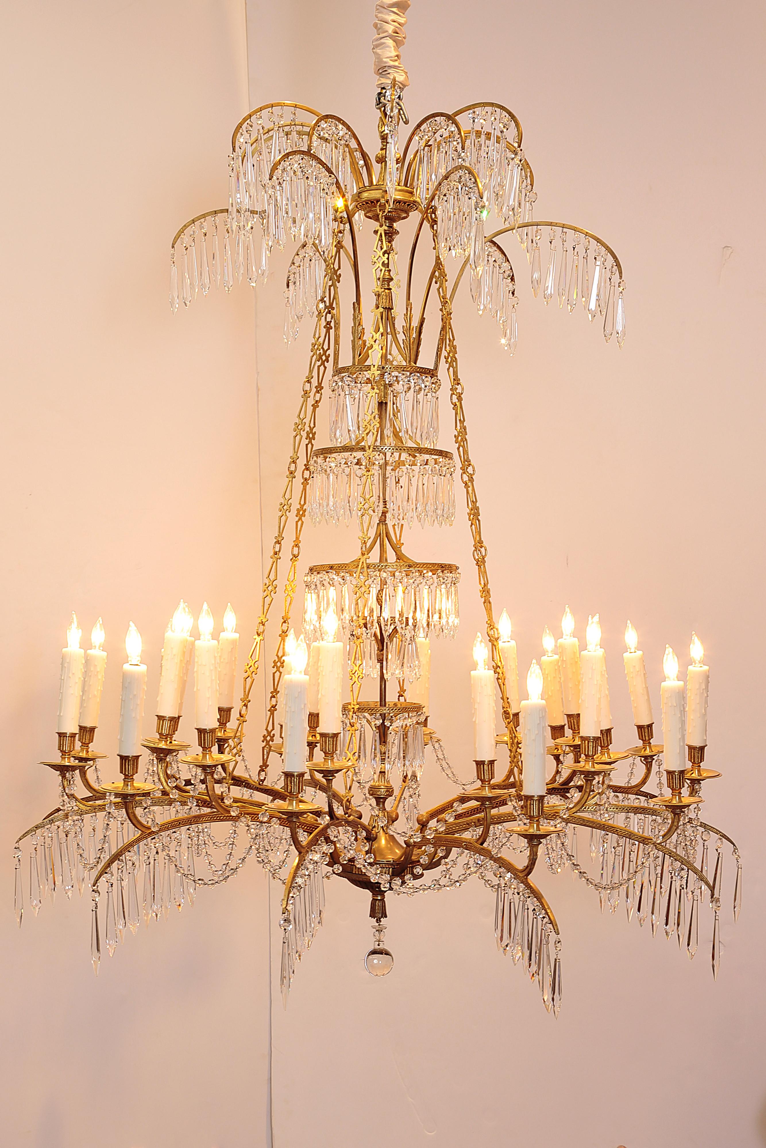 A German neoclassic ormolu and cut-glass twenty-four light chandelier, circa 1795, probably Berlin and attributable to Werner & Mieth, founded 1792, one of the great artistic foundries of the age of European Neoclassicism. 

drilled for electricity,