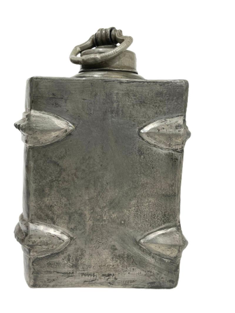 A German pewter decanter in the shape of a book

A pewter decanter in the shape of a book. 
German decanter, marked with B. Weber Koenigshofen. 
Approx. 1900

The measurements are 26 cm high, 10 cm wide and the depth is 18 cm
The weight is