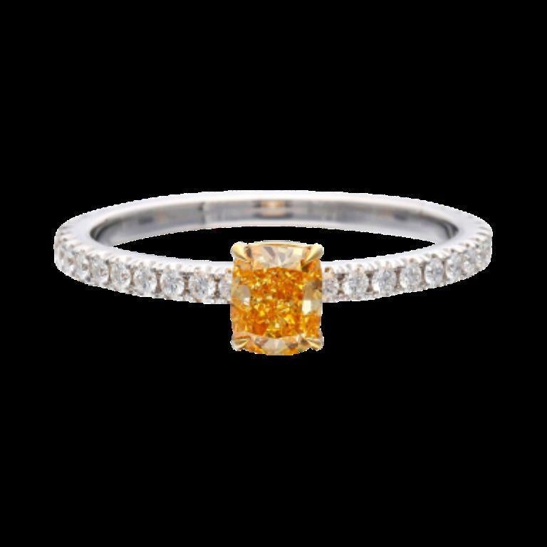 Centering a 0.51 carat Fancy Yellowish-Orange diamond, accented by 30 round brilliant cut diamonds.
- Fancy Yellowish-Orange diamond weighs 0.51 carat
- Round diamonds weighing a total of approximately 0.30 carat
- Size 6 1/2
- Total weight 1.93