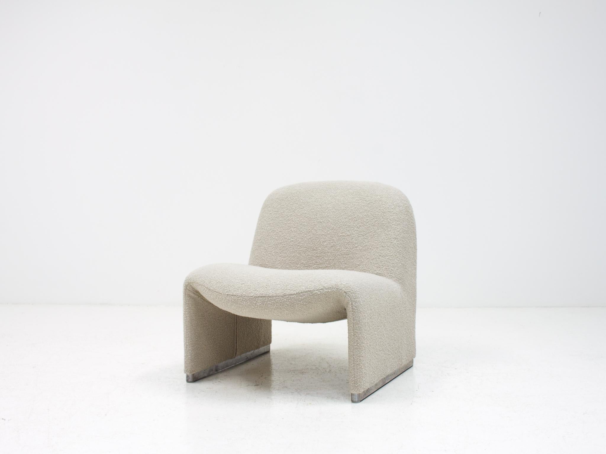 A Giancarlo Piretti “Alky” chair newly upholstered in a 'Flax' colored Yarn Collective bouclé fabric. The fabric is grey in appearance with a very pale olive hue, we have included two fabric screenshots from the manufacturer's website but the colour