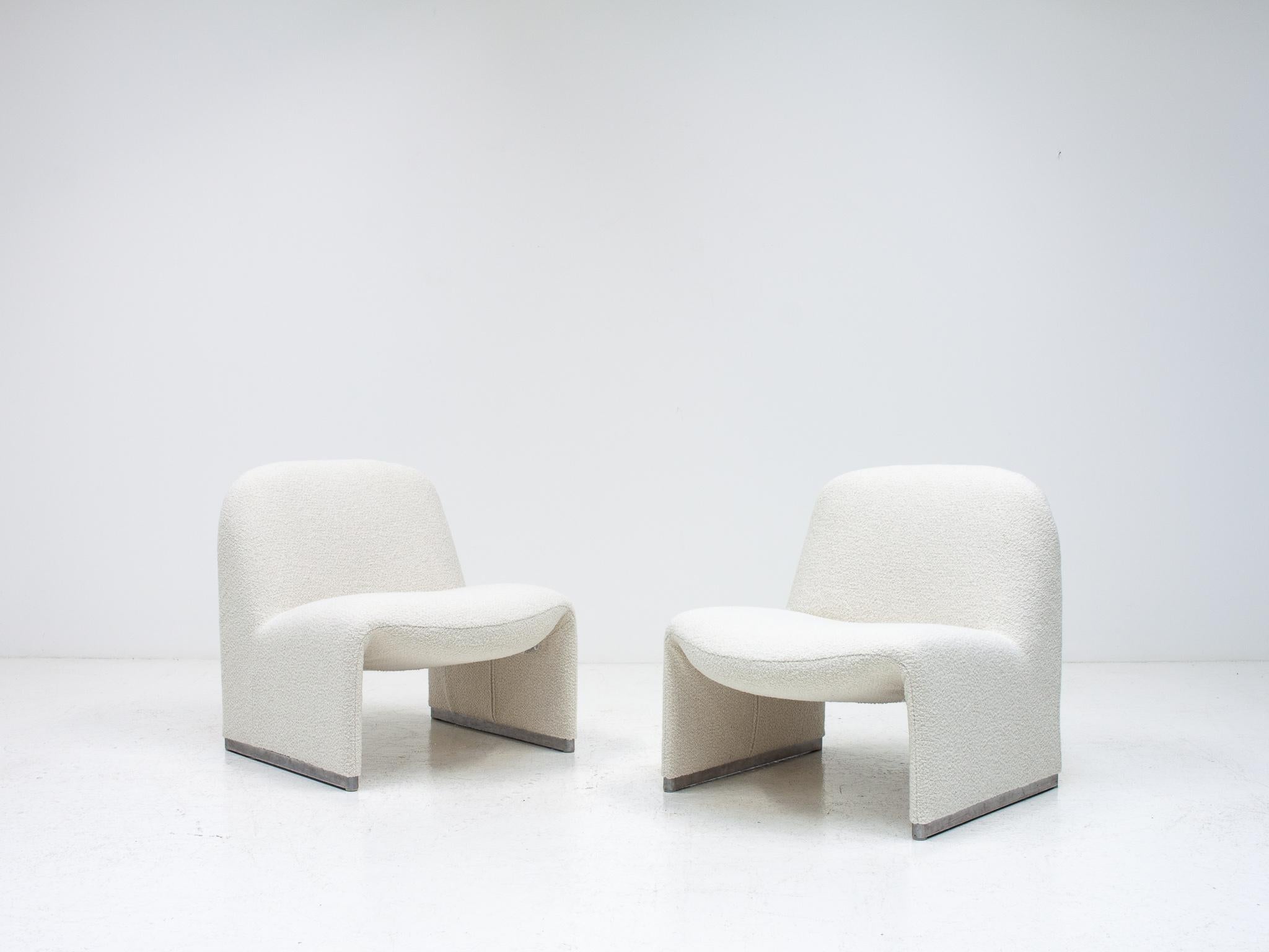 A pair of Giancarlo Piretti “Alky” chairs newly upholstered in a 'Parchment' colored Yarn Collective bouclé fabric.  

Parchment is a light, neutral, sepia, off-white colour, we have included screenshots from the fabric manufacturer's website to