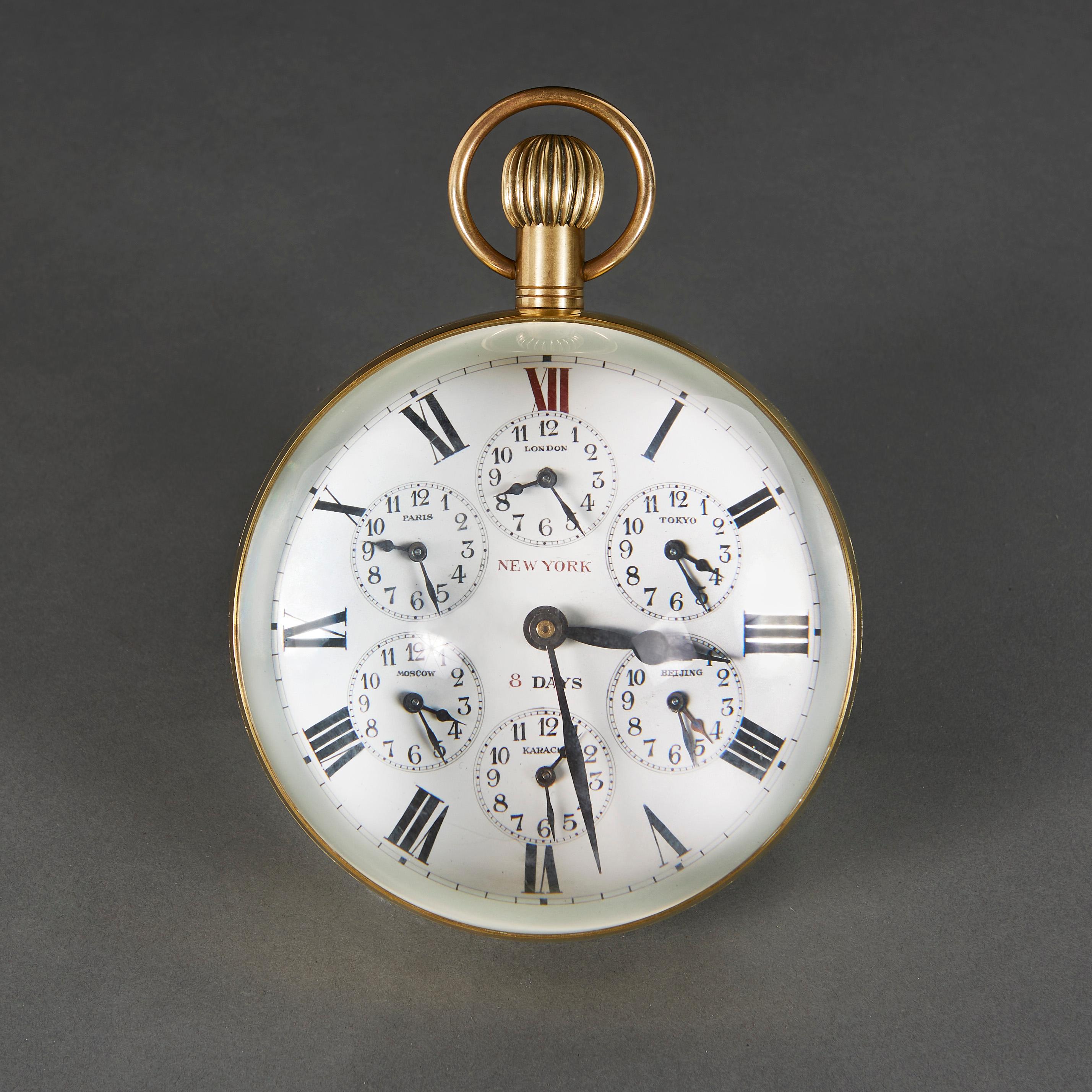Elgin National Watch Company, Illinois, USA, early 20th century

A Fine giant ball desk clock in brass and glass, the dial with six subsidiary dials for London, Paris, Tokyo, Moscow, Karachi and Beijing, with eight day American movement by Elgin