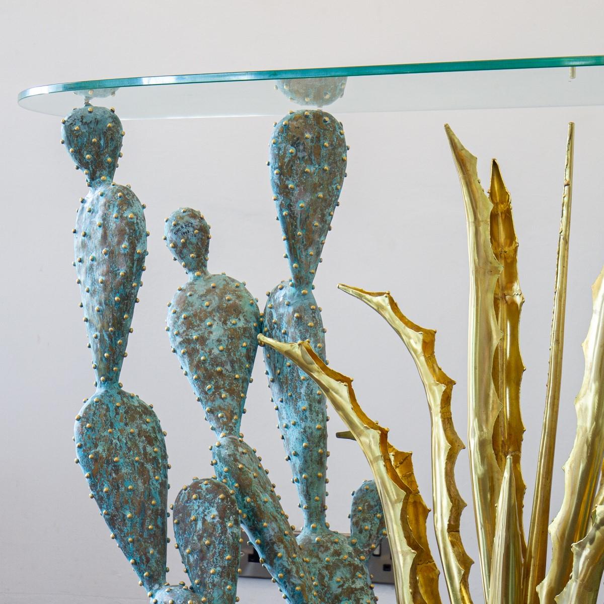 A gilded and oxidized brass cacti sculpture complete with a glass top to create a console table, titled 'Tulum' created by Alain Chervet in 1992, Signed and dated. The console base comprises of oxidised brass prickly pear cacti with gilt spike