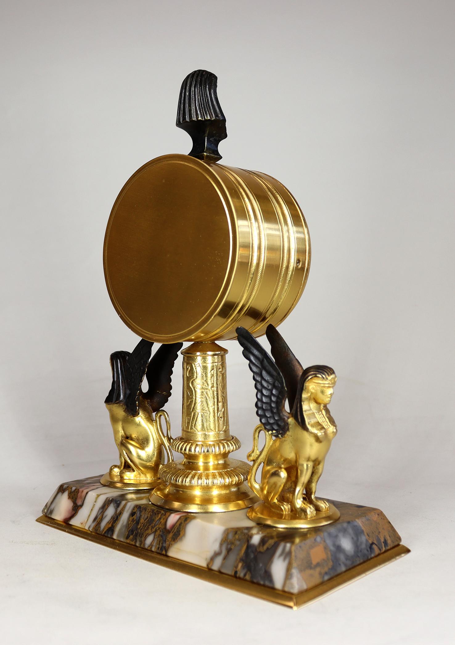 A Gilded Egyptian Revival Timepiece Desk Clock In Excellent Condition For Sale In Amersham, GB