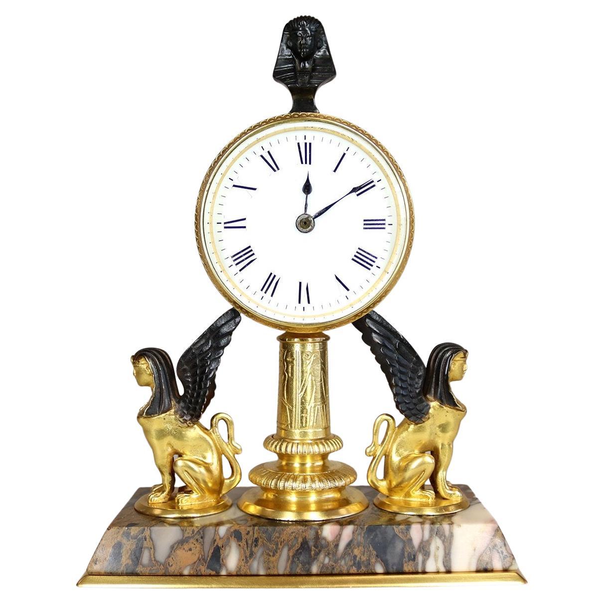 A Gilded Egyptian Revival Timepiece Desk Clock For Sale