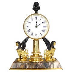 A Gilded Egyptian Revival Timepiece Desk Clock