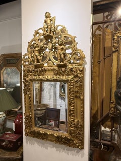 A Gilded Mirror with Three Cherubs, 19th Century