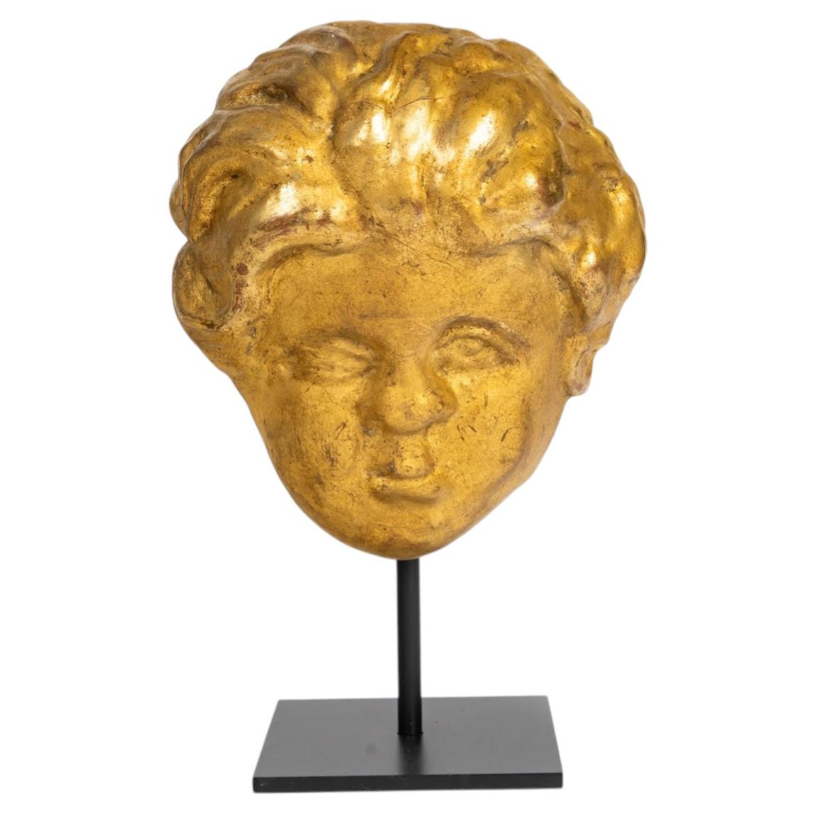A Gilded Wooden Sculpture Of a Cherub’s Head From The 17th Or 18th Century. For Sale