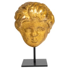 A Gilded Wooden Sculpture Of a Cherub’s Head From The 17th Or 18th Century.