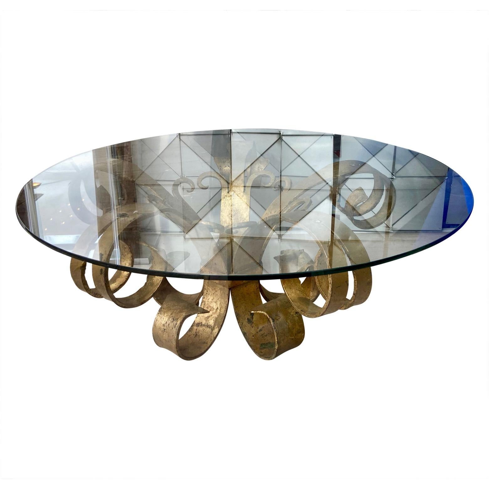 A heavy Hollywood Regency gilded wrought iron coffee table base, Italy or France, circa 1950's.
This base would take a circular glass top of between 80 and 100cm diameter.
We are selling the base separately, in order to give our customers the