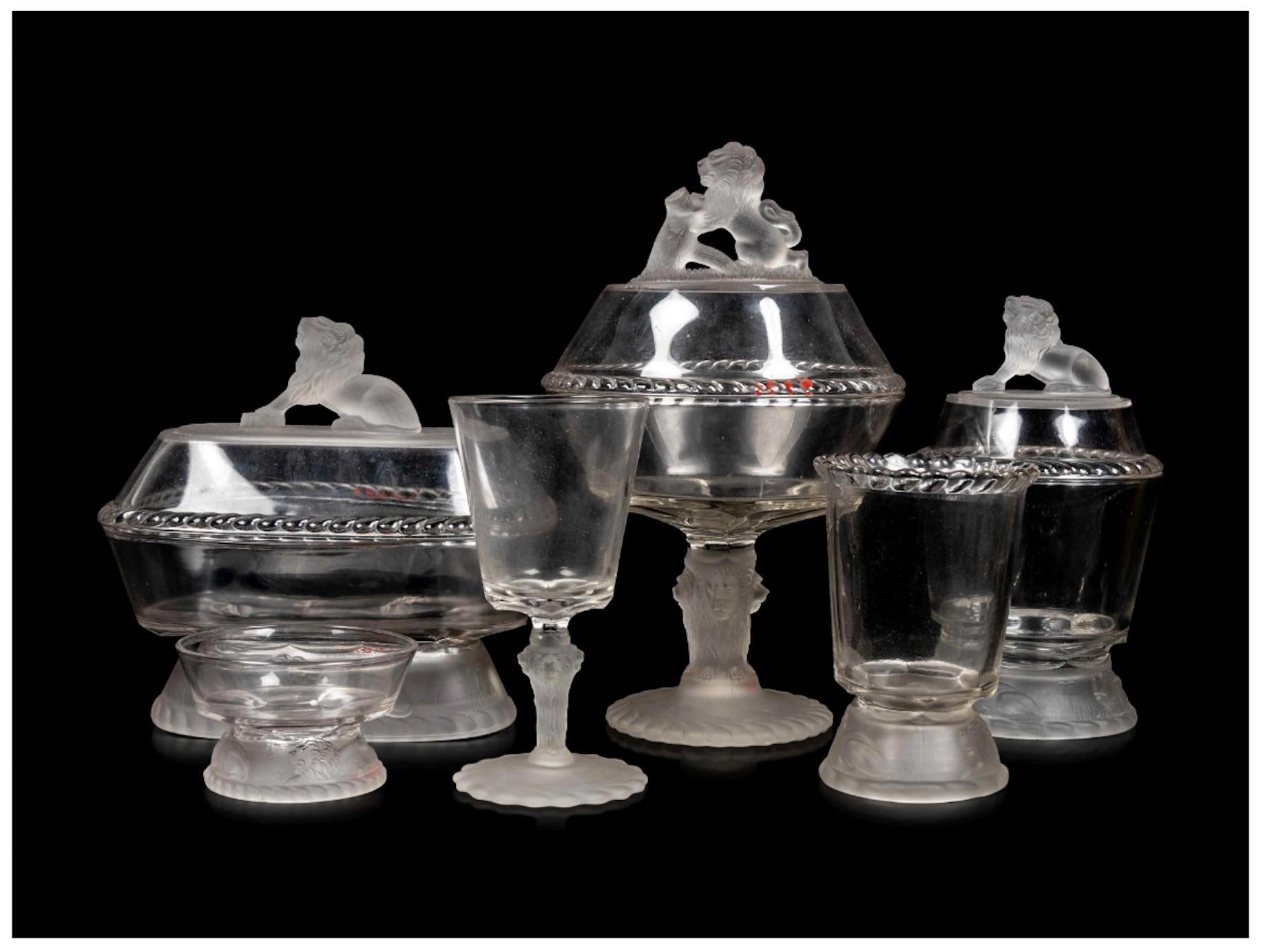 A Gillinder and Sons Lion Pattern Glass Service
Philadelphia, PA, Second Half 19th Century
comprising compotes, goblets, an egg cup, sauce dishes, plates, platters, and other articles.
Height of tallest compote 13 1/2 inches.