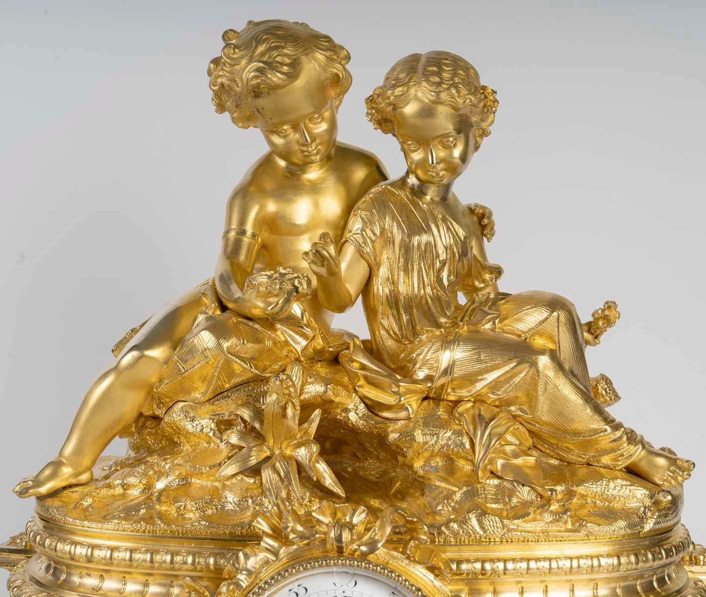French A Gilt and Chased Bronze Clock, a Marble Base, Napoleon III Period, 19th Century