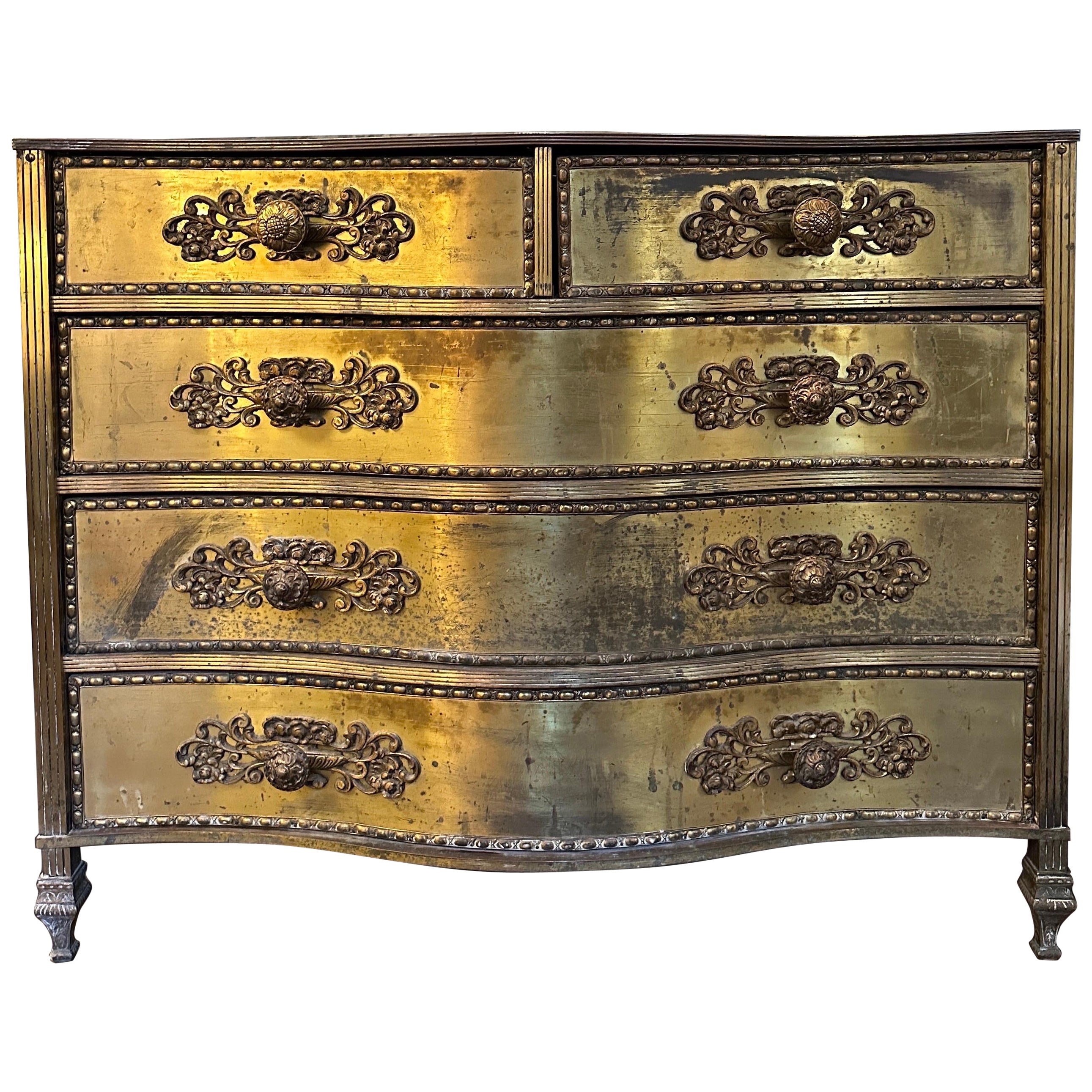 A Gilt Brass And Black Glass Serpentine Front Commode
