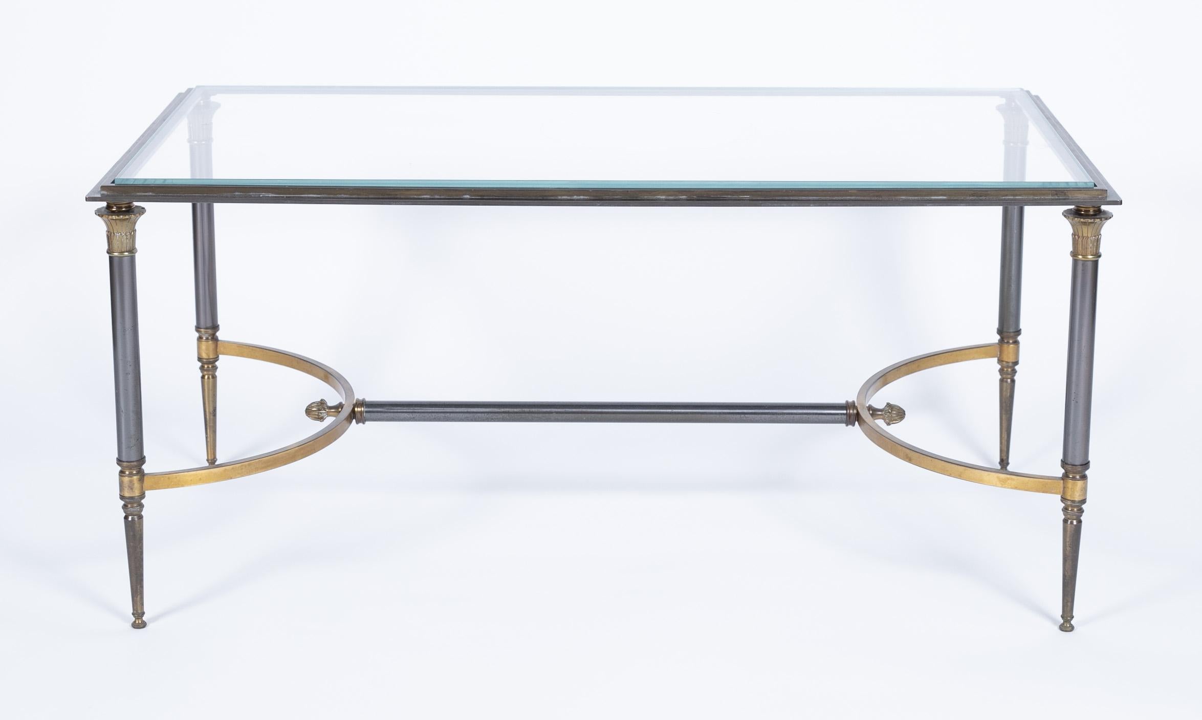 A well cast neoclassic coffee table in gilt bronze and steel designed by Maison Charles, circa 1970.