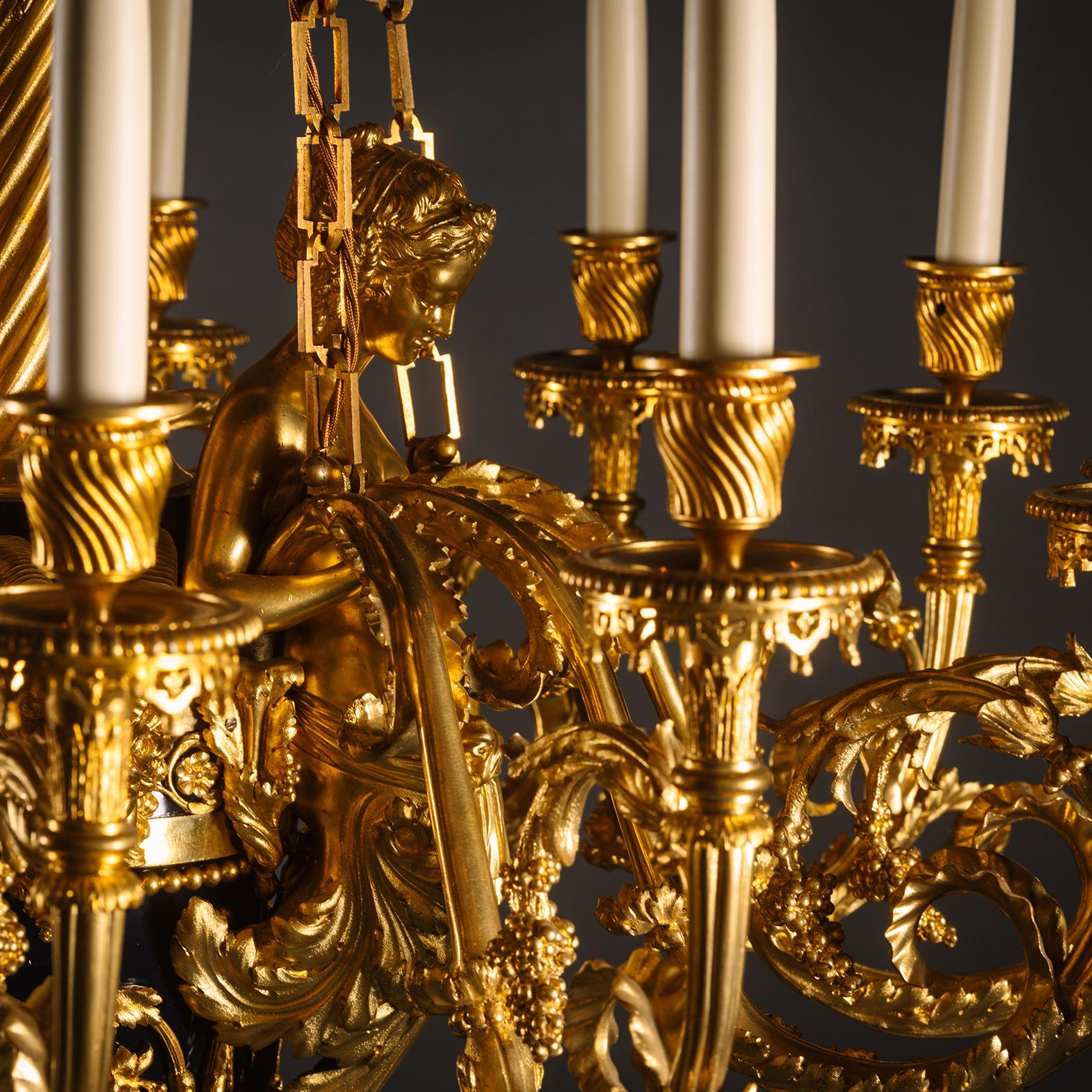 French A Gilt-Bronze and Tole Twelve-Light Chandelier, Attributed to Maison Beurdeley For Sale