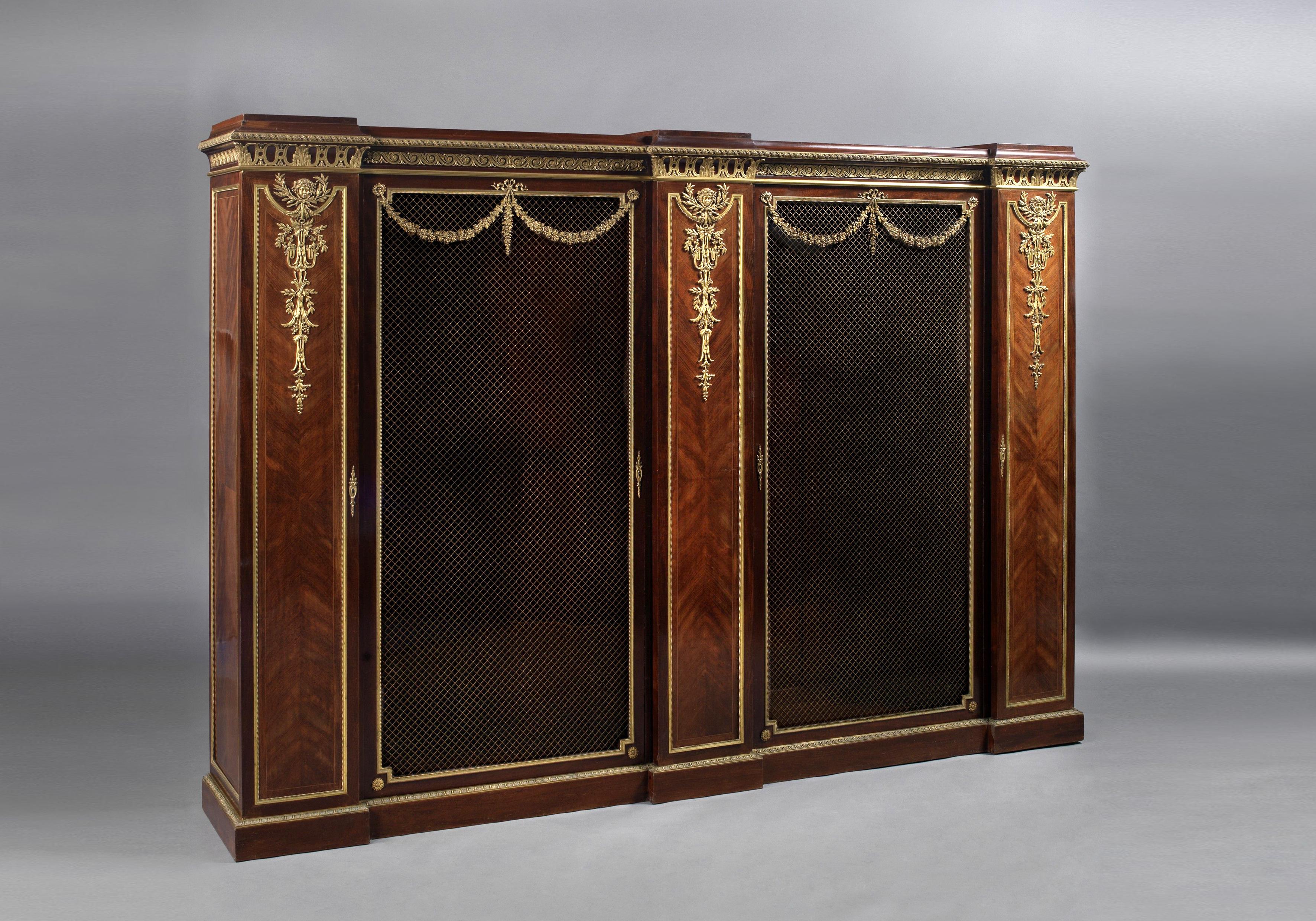 A fine gilt-bronze mounted mahogany and satine bookcase by François Linke.

French, circa 1890. 

Linke Index No. ‘1131’
Inscribed ‘F. Linke’ above the center right-hand door.
The reverse of the lockplates stamped 
‘CT