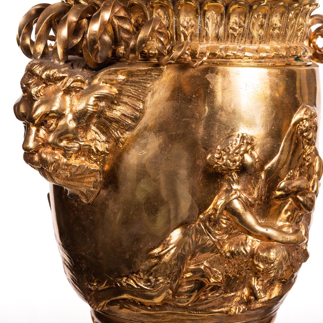A gilt bronze urn-form table lamp,
after the antique, a gilt bronze urn-form table lamp. 
Measures: Height 31 in. (78.74 cm.) (overall ) 
Width 8 in. (20.32 cm.) 
Depth 7 in. (17.78 cm.)
 