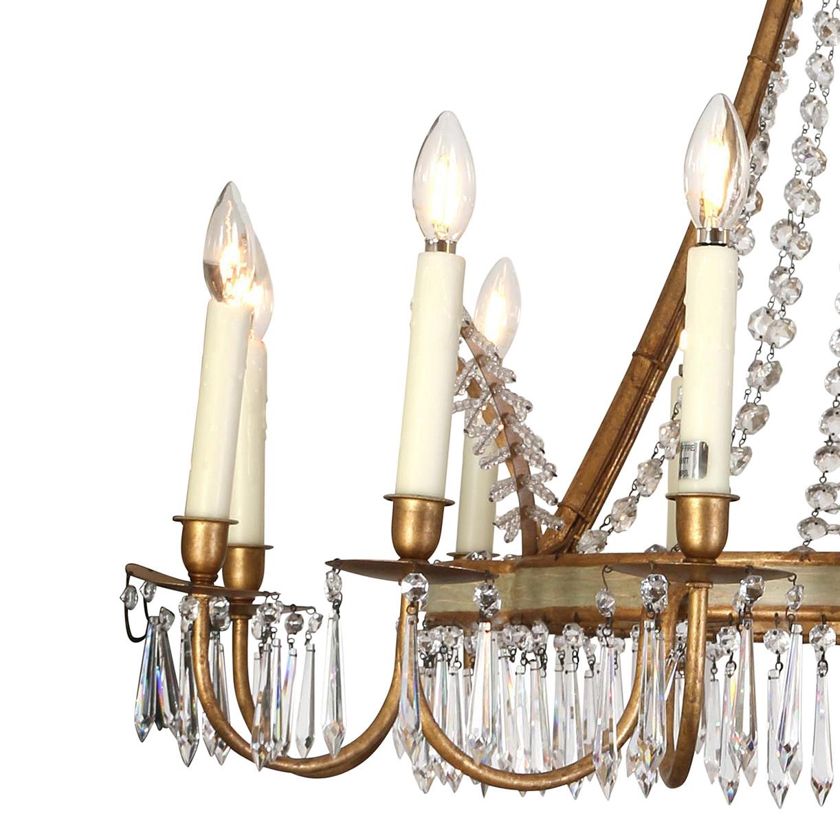 A fantastic twelve-arm chandelier with a painted and parcel gilt curved center ring, decorated with crystal prisms hanging from the ring and strings of glass beads suspended from the painted 