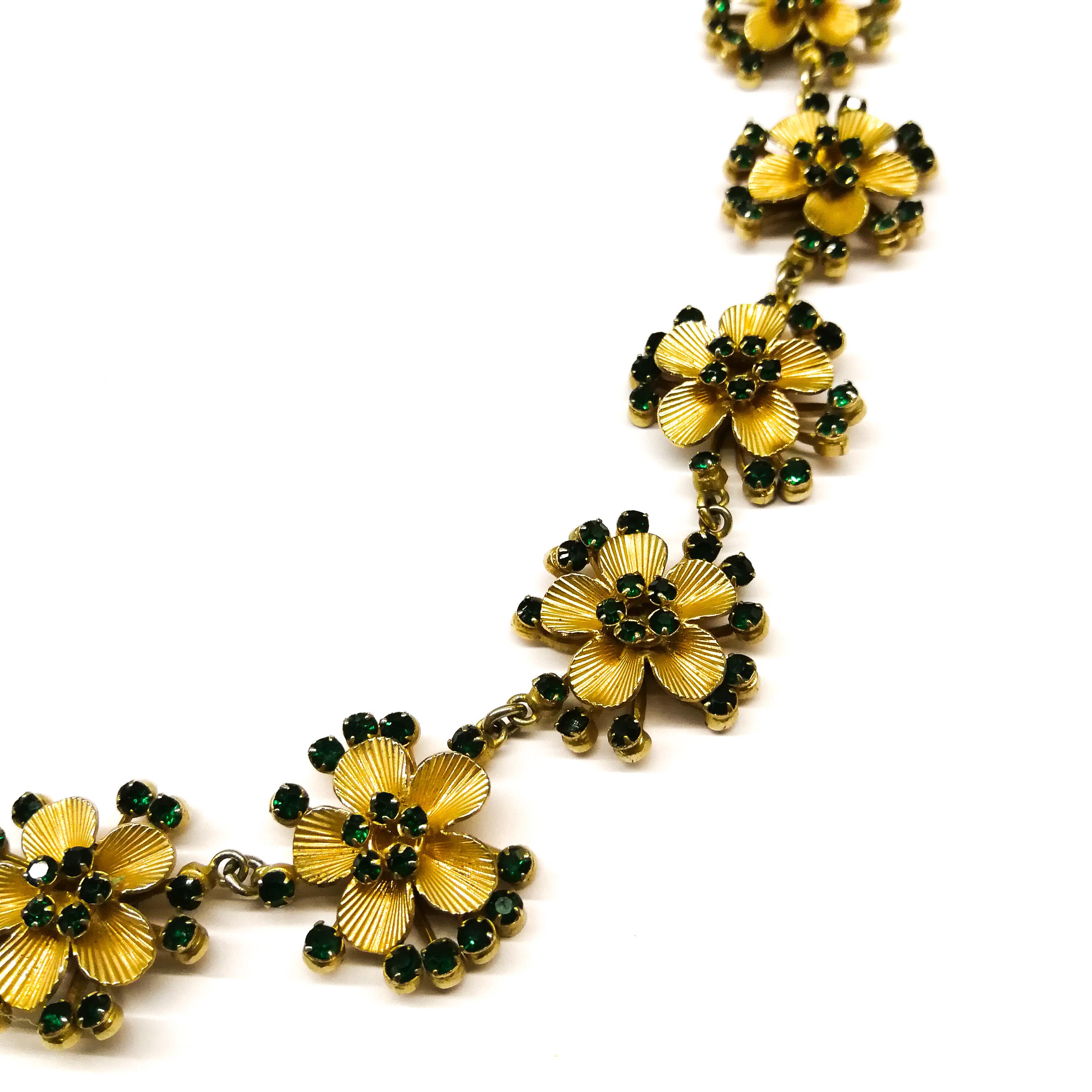 A very pretty necklace made by Henkel and Grosse  for Christian Dior in Germany, made from soft gilded metal and gently sparkling emerald pastes. Set on individual gilt 'stamens', each paste is claw set, creating a small flower motif. This rare