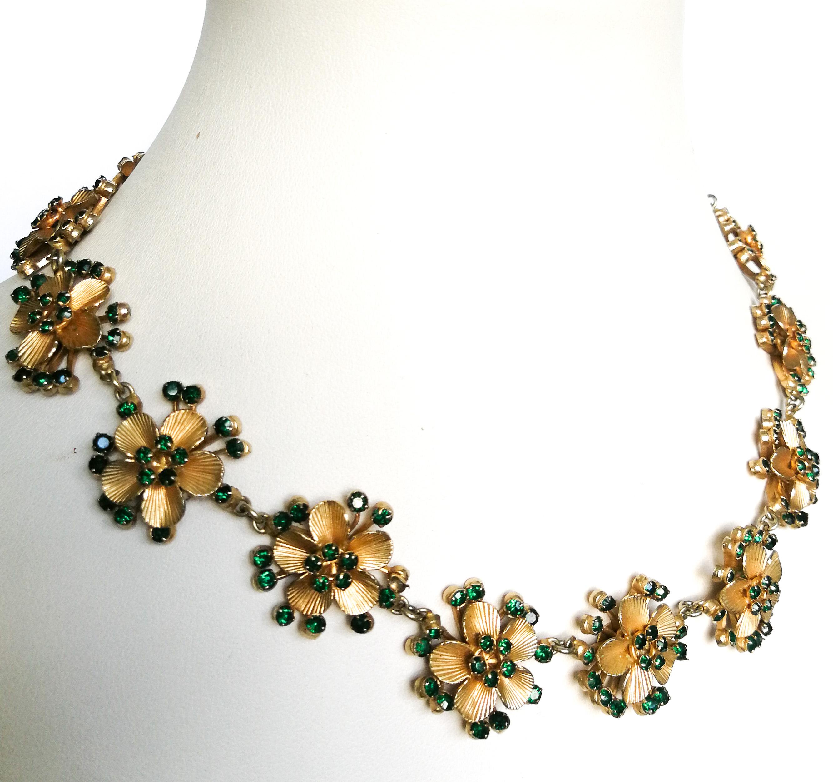 A gilt metal and emerald paste stylised floral necklace, Christian Dior, c 1957. 1