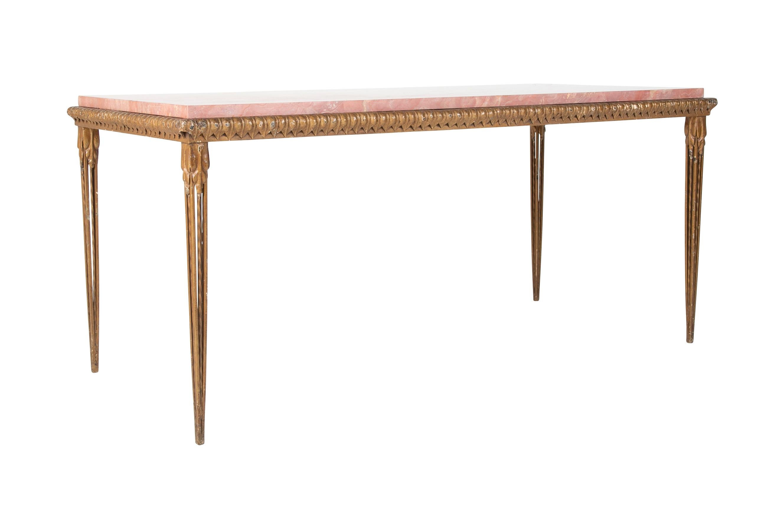 A Gilbert Poillerat style console table in gilt metal and Roso Verona Marble top.