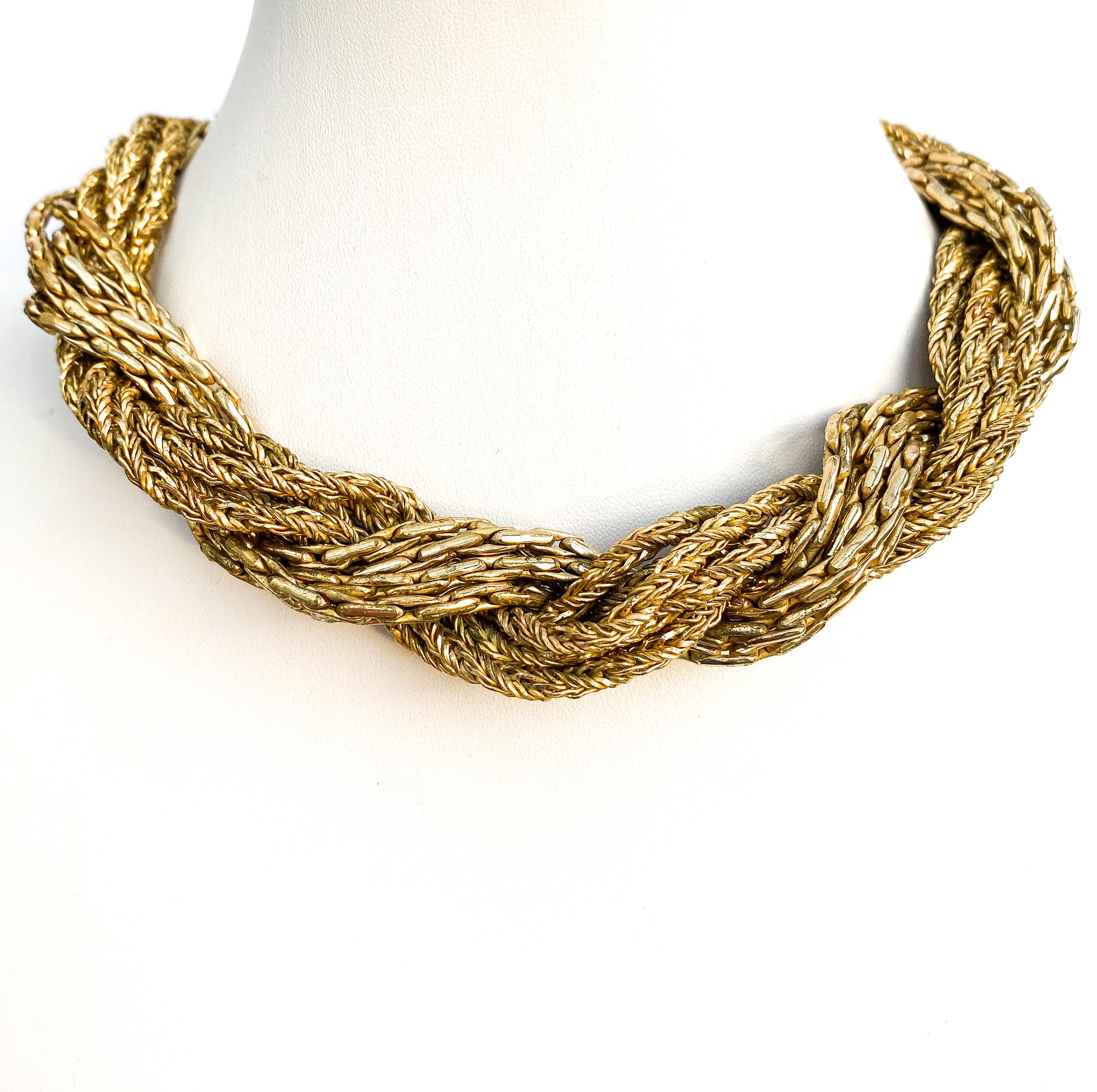 A striking and elegant choker necklace, beautifully made of two different chain elements that twist, one with the other, of outstanding quality. Very classic in its design, and very classic Dior of this period, this necklace would work perfectly in