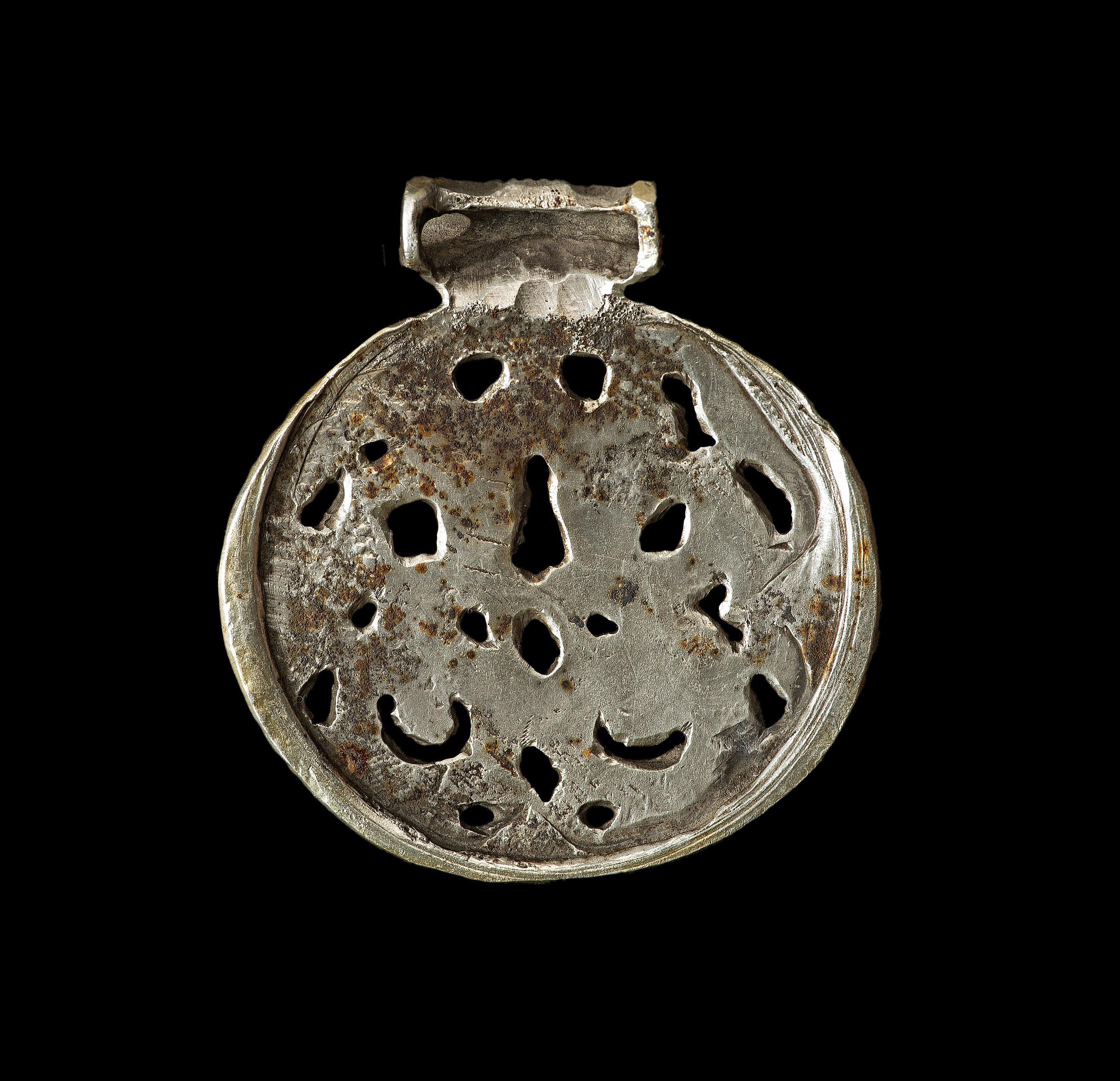 Origin: Viking inhabited area of Europe.

Gilt silver. A concave-section pendant with integral suspension loop. The openwork plaque with two internal stylized zoomorphic beasts in shape of dragons.

Height 47.2 mm. Weight 39 gr.

Condition