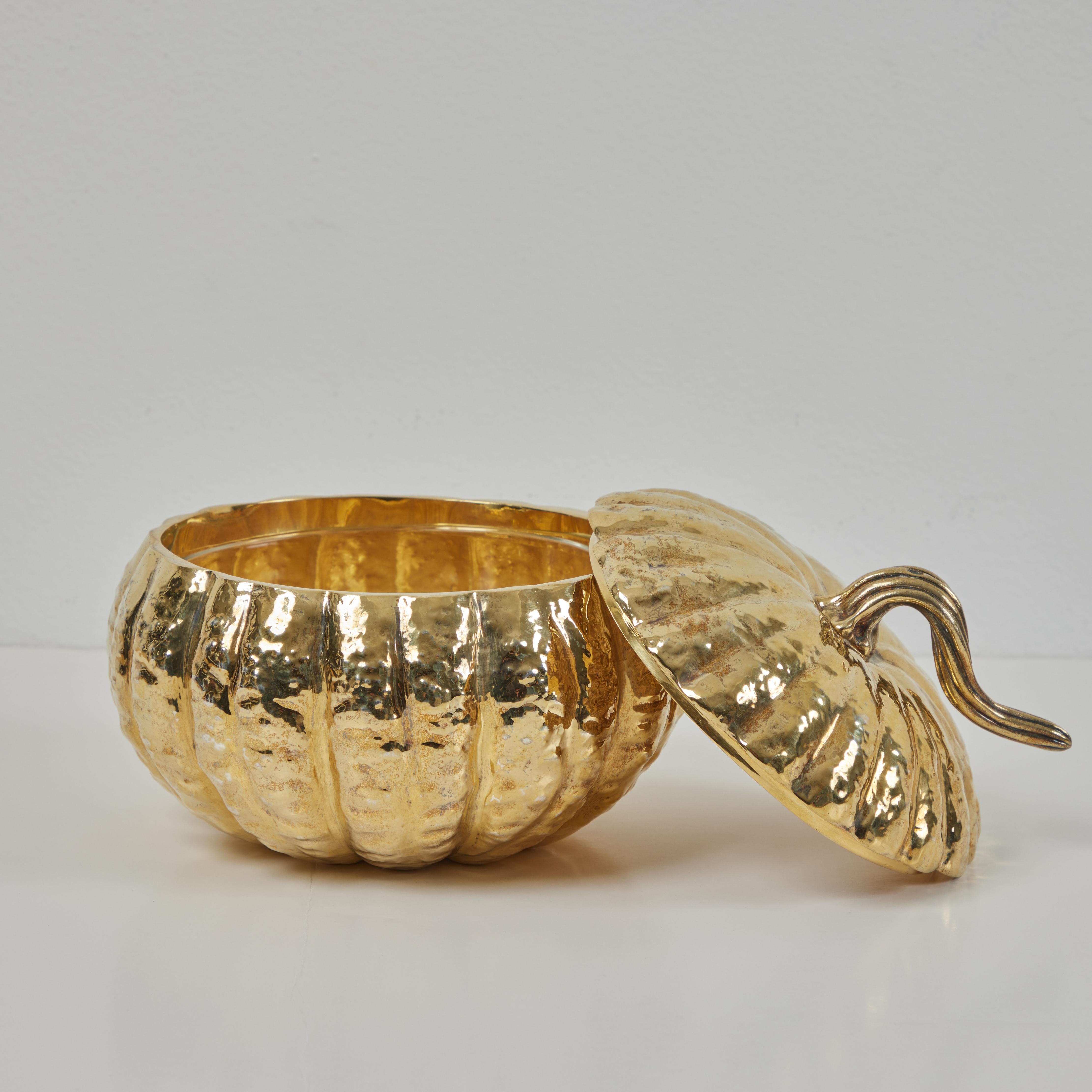 This is a beautiful sculpted and chased pumpkin tureen by Italian jeweler Nardi Venezia. A rare piece for Nardi, the pumpkin is fashioned in sterling silver and has been finished in a soft gold gilt finish.  A textured stem acts as the handle of the