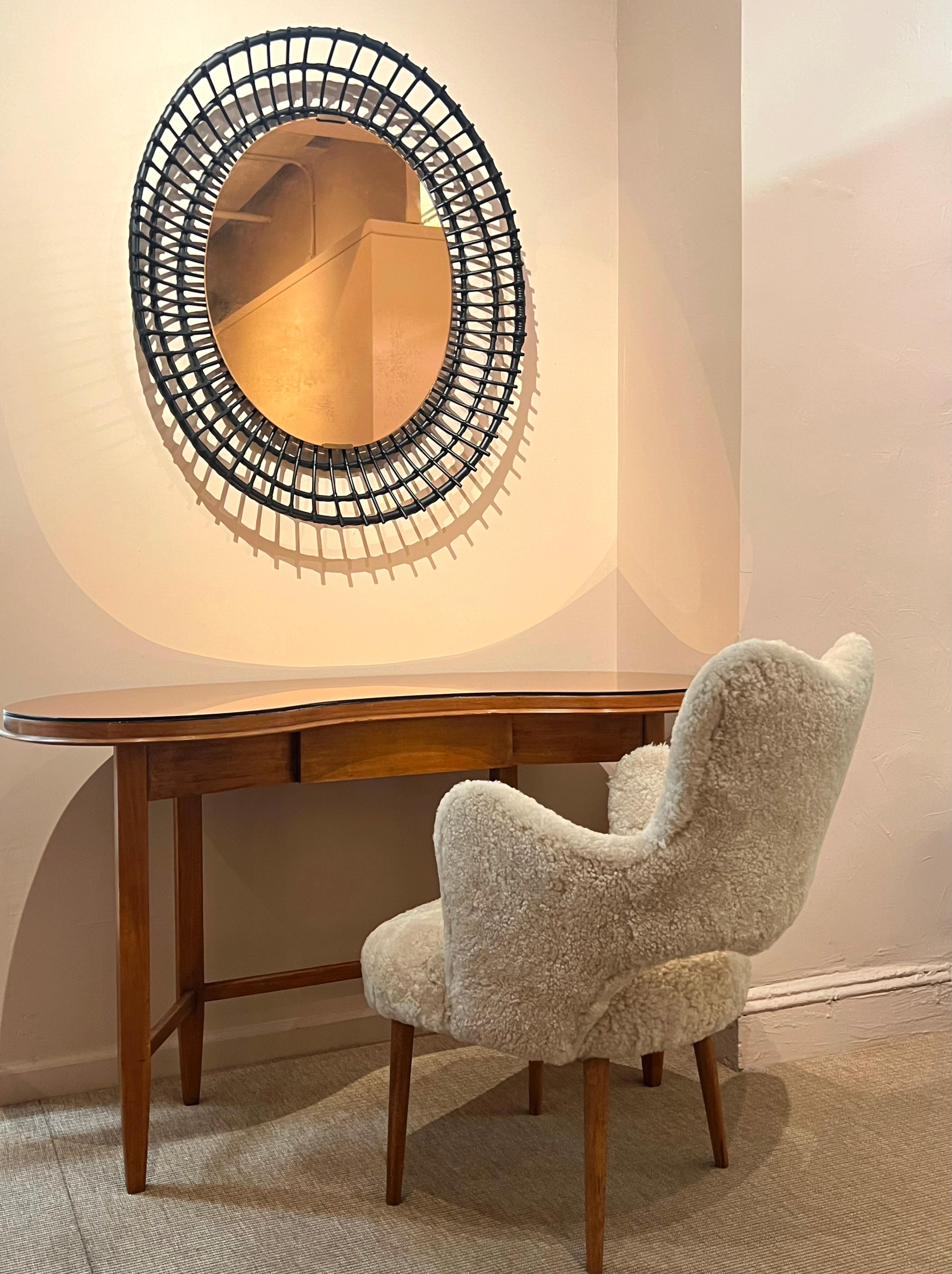 A stunning Gio Ponti Console Table in Walnut, glass, and tinted mirror.
Creation date: circa 1935. The copper mirror glass top has been replaced, replicating the original.

Bibliography: La casa all'italiana, Editoriale Domus, Milan, 1933, similar