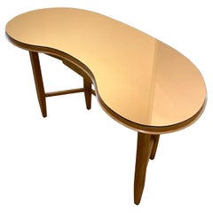 A Gio Ponti Console table in walnut and copper colored glass