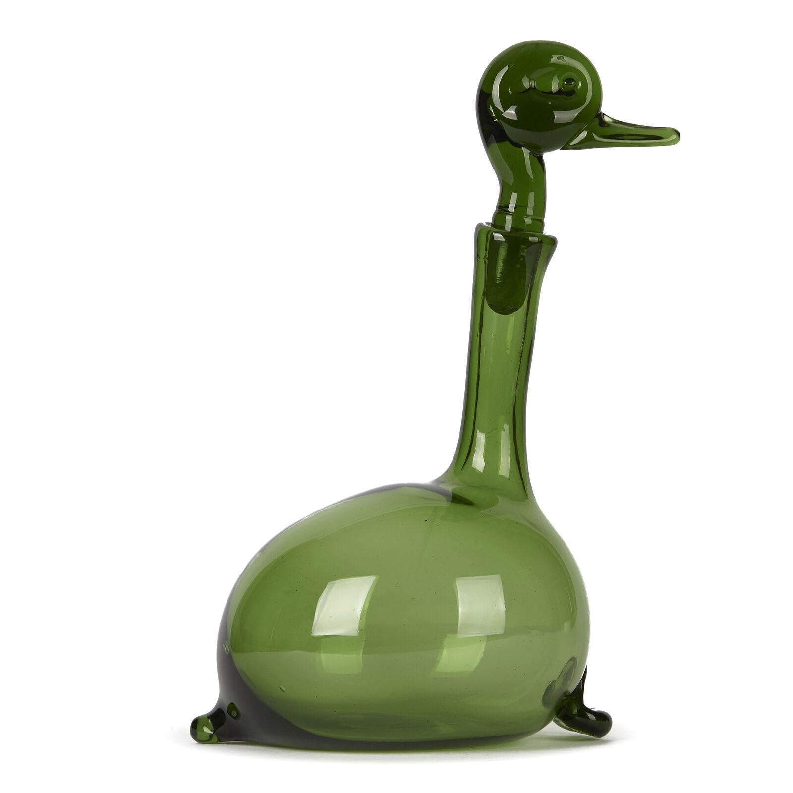 A mid twentieth century green Murano glass wine decanter in the form of a duck, the base with feet to the front and tail to the rear, and the stopper in the form of the duck’s head. Made with Murano Empoli Verde glass. Designed by Gio Ponti.


