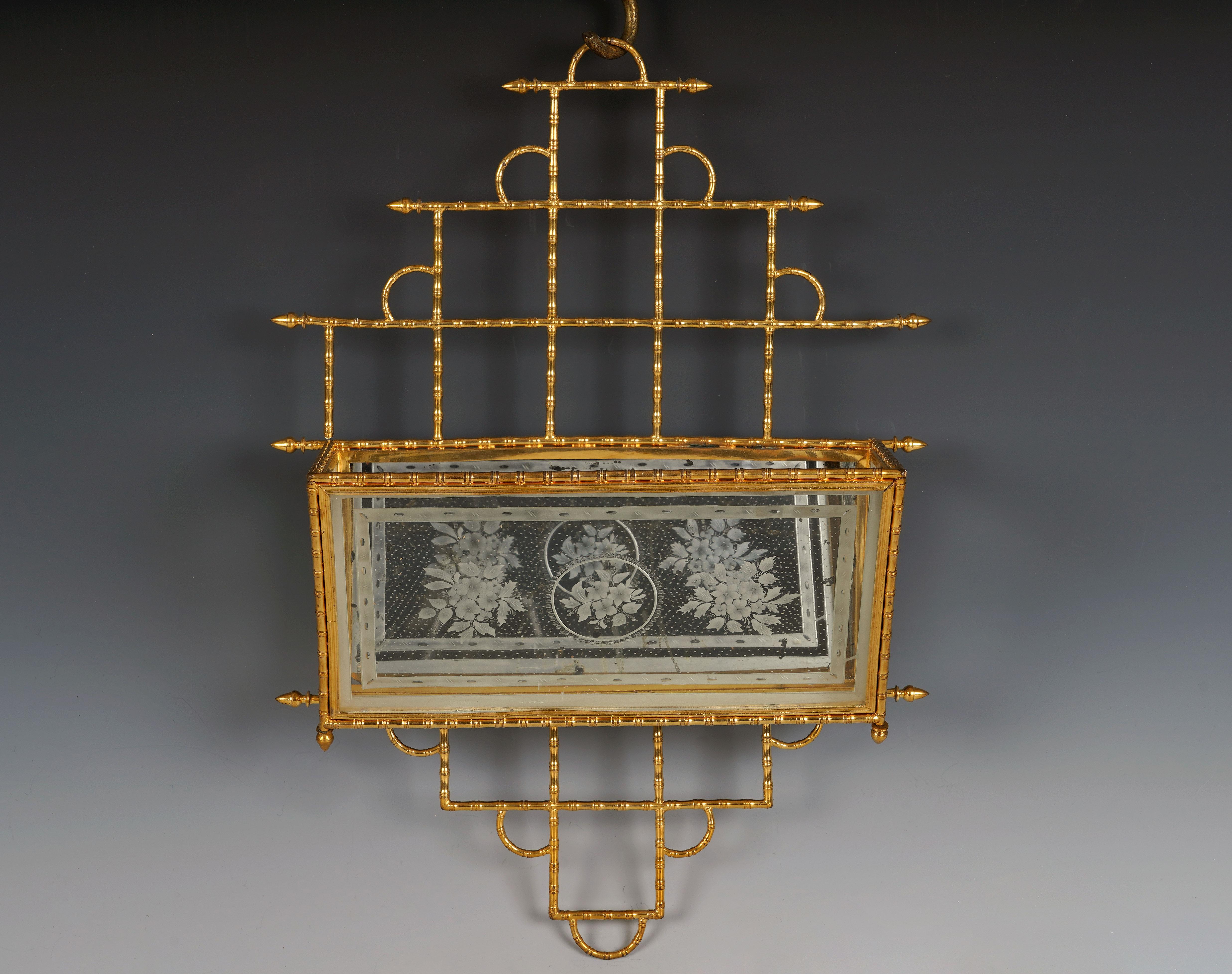 Charming Japanese-inspired wall-mounted letter rack in chiseled and gilded bronze with geometric uprights imitating bamboo. The letter compartment is made up of three glass panes engraved with floral motifs, and a mirror at the bottom.

Biography
