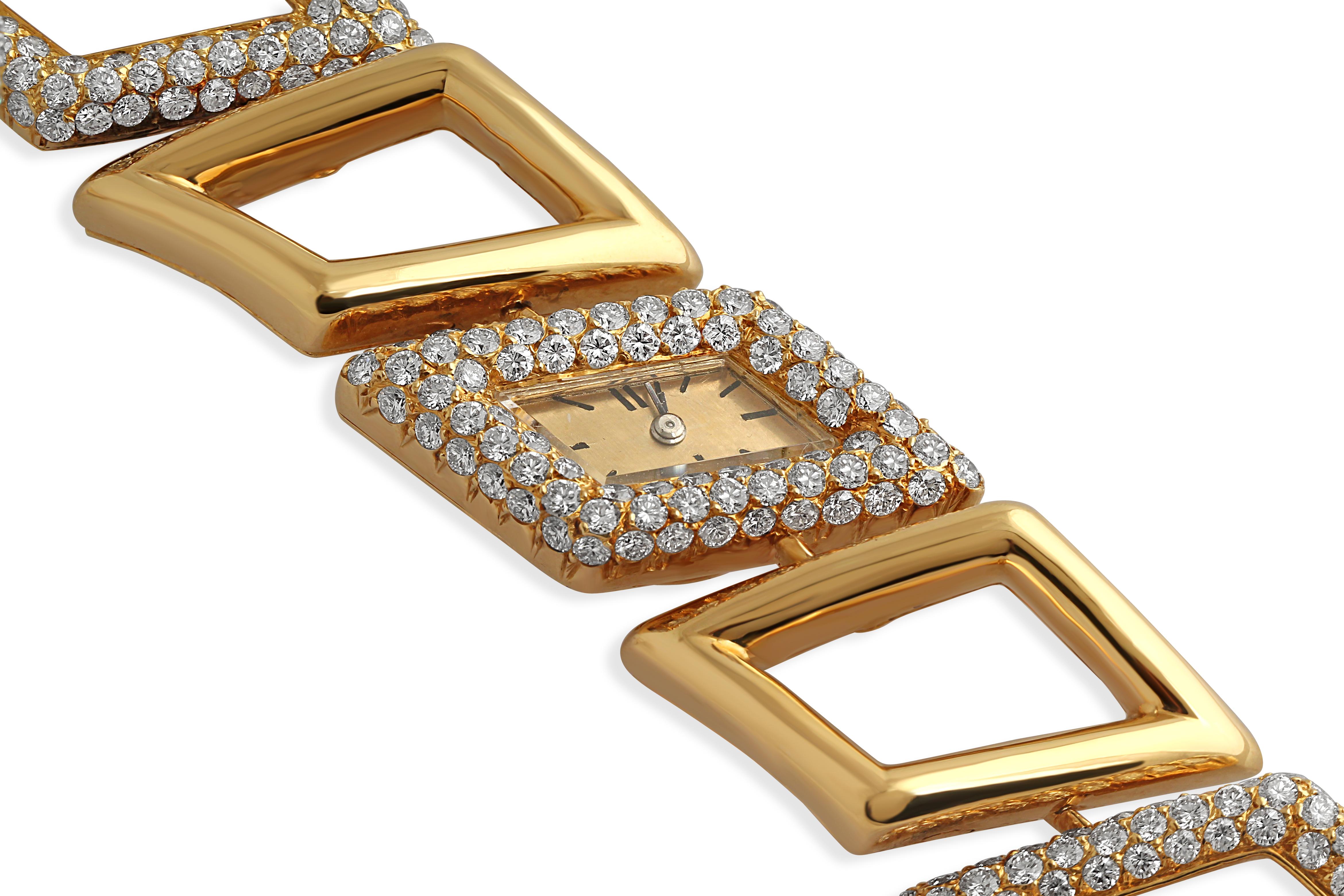 A glamorous 18k yellow gold ladies wristwatch by M.Gerard. Set with approximately 8.50 carats of diamonds. Weight = 71gr.