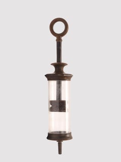 A glass and vulcanite syringe, London 1880.