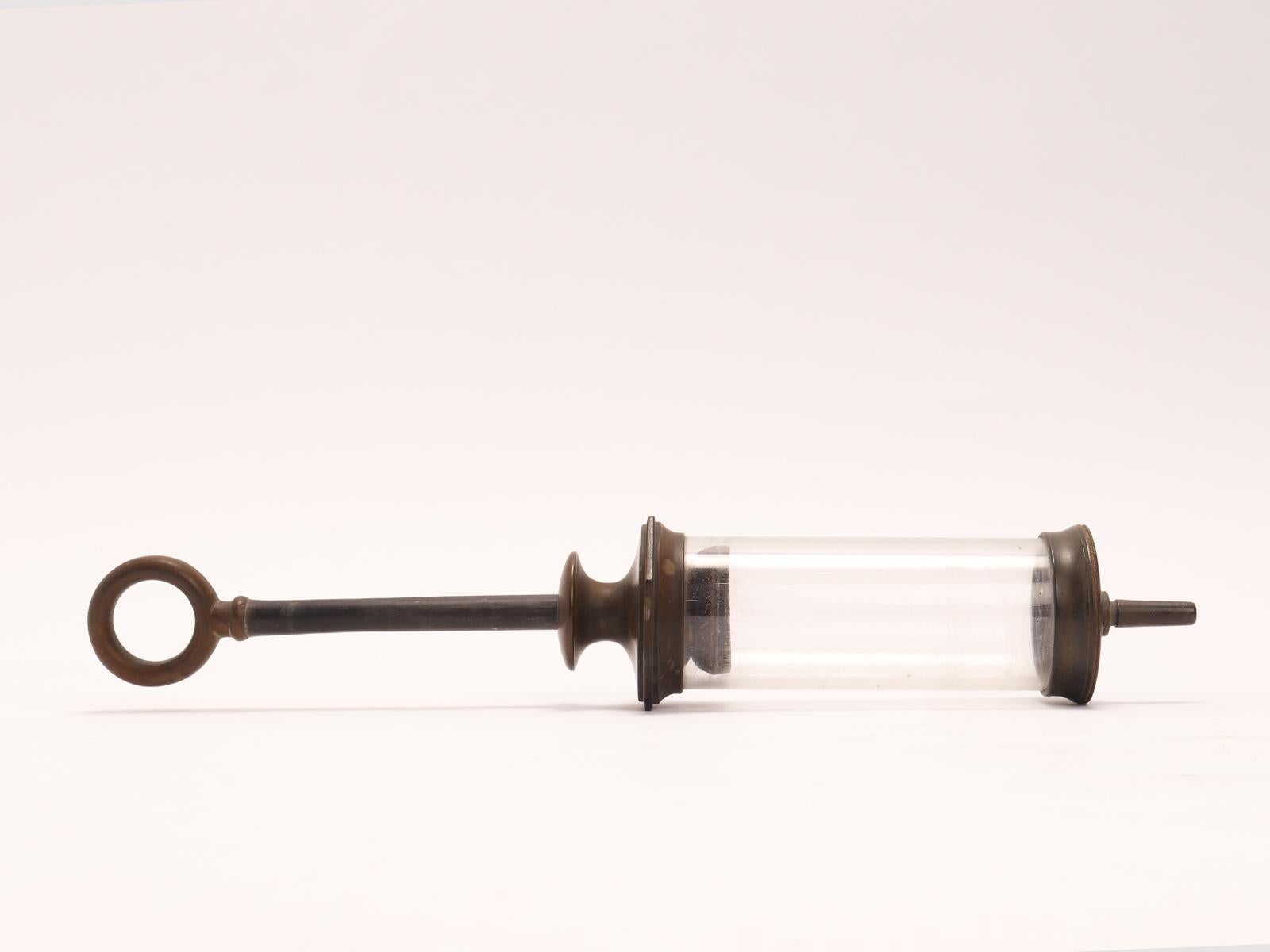 19th Century A glass and vulcanite syringe, London 1880.  For Sale