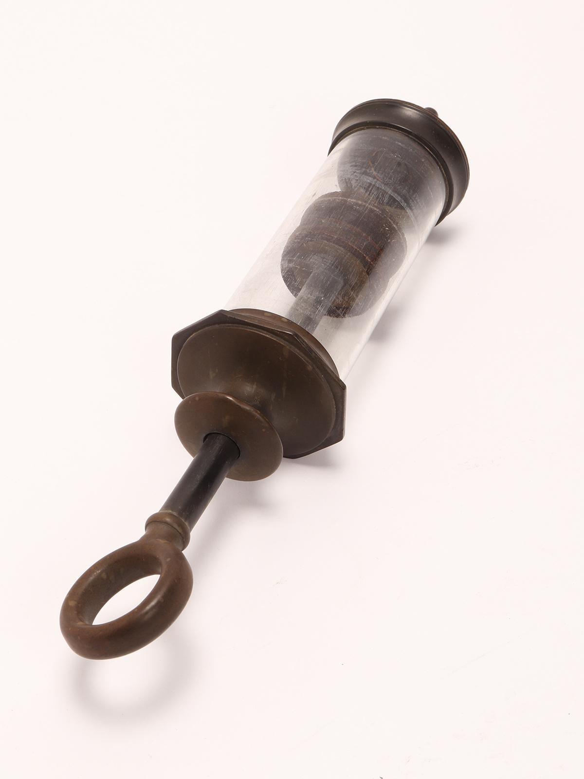 19th Century A glass and vulcanite syringe, London 1880.  For Sale