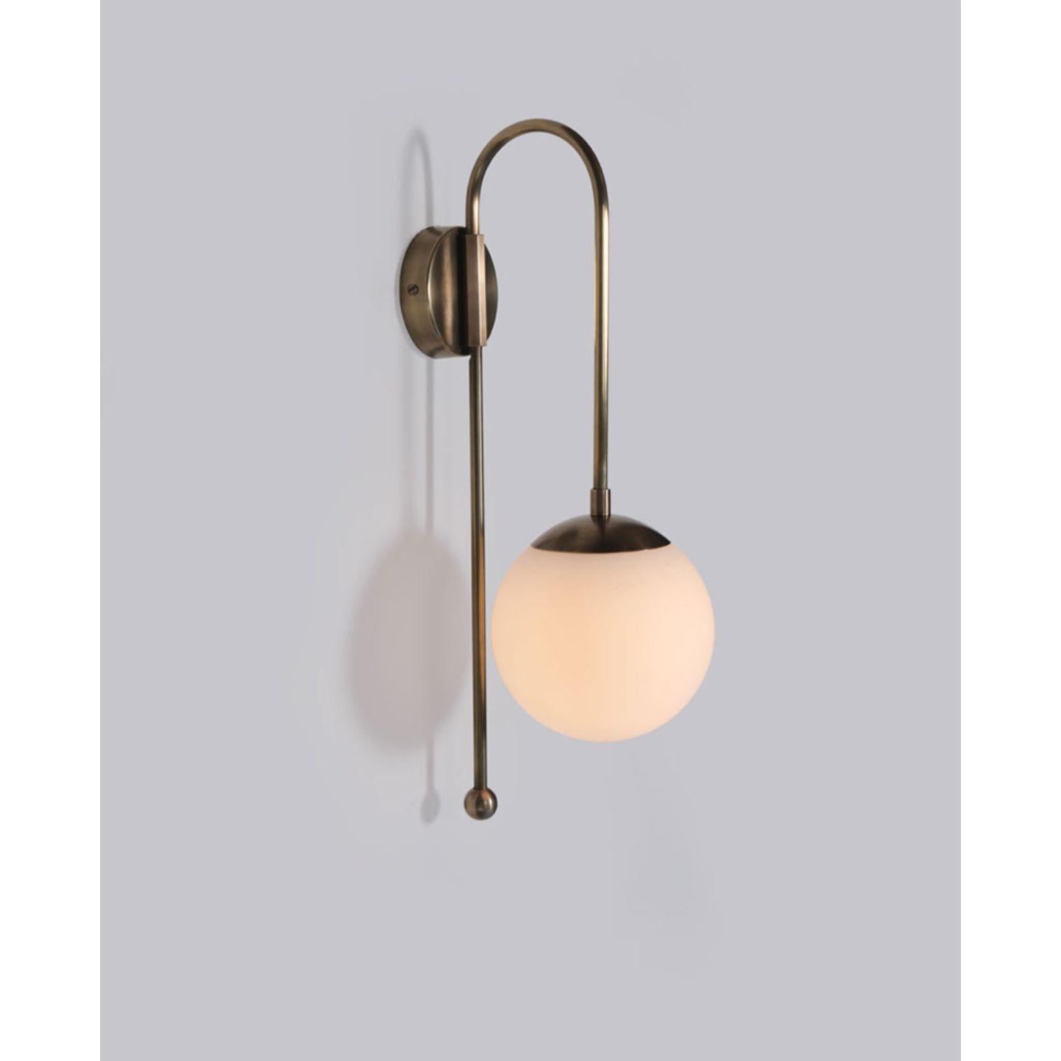 A Glass Dome Wall Sconce by Lamp Shaper
Dimensions: D 15.5 x W 22 x H 48.5 cm.
Materials: Brass and glass.

Different finishes available: raw brass, aged brass, burnt brass and brushed brass Please contact us.

All our lamps can be wired according