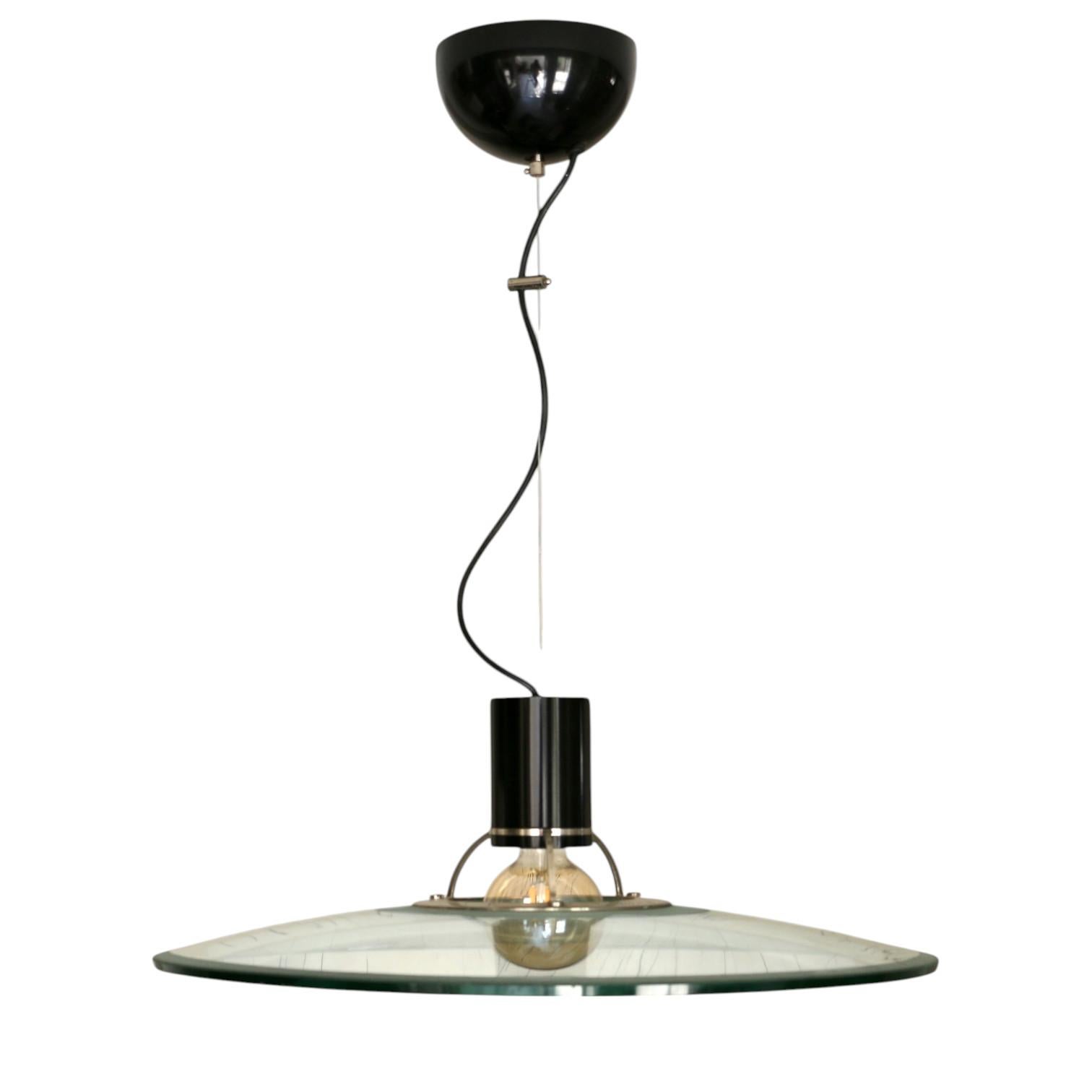 A large chandelier in thick glass, solid chrome and black lacquered metal, Italy 70s.
