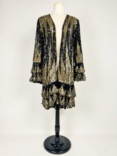 A glittering Art Deco evening coat embroidered with gold and black sequins - Fra