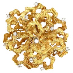 A Gold and Diamond Brooch.