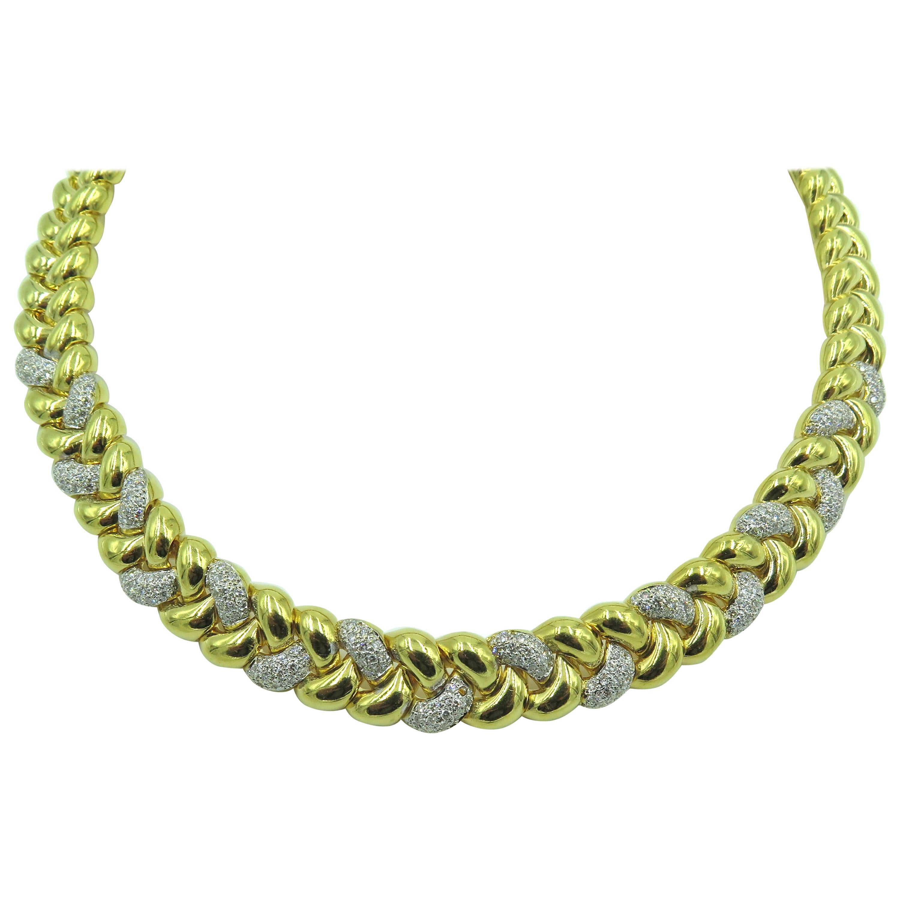 An 18 karat yellow gold and diamond necklace. Italian. Circa 1990. Designed as a polished gold braided collar, enhanced by pave set diamonds. Two hundred and thirty eight diamonds weigh approximately 2.40 carats. Length is approximately 16 1/2