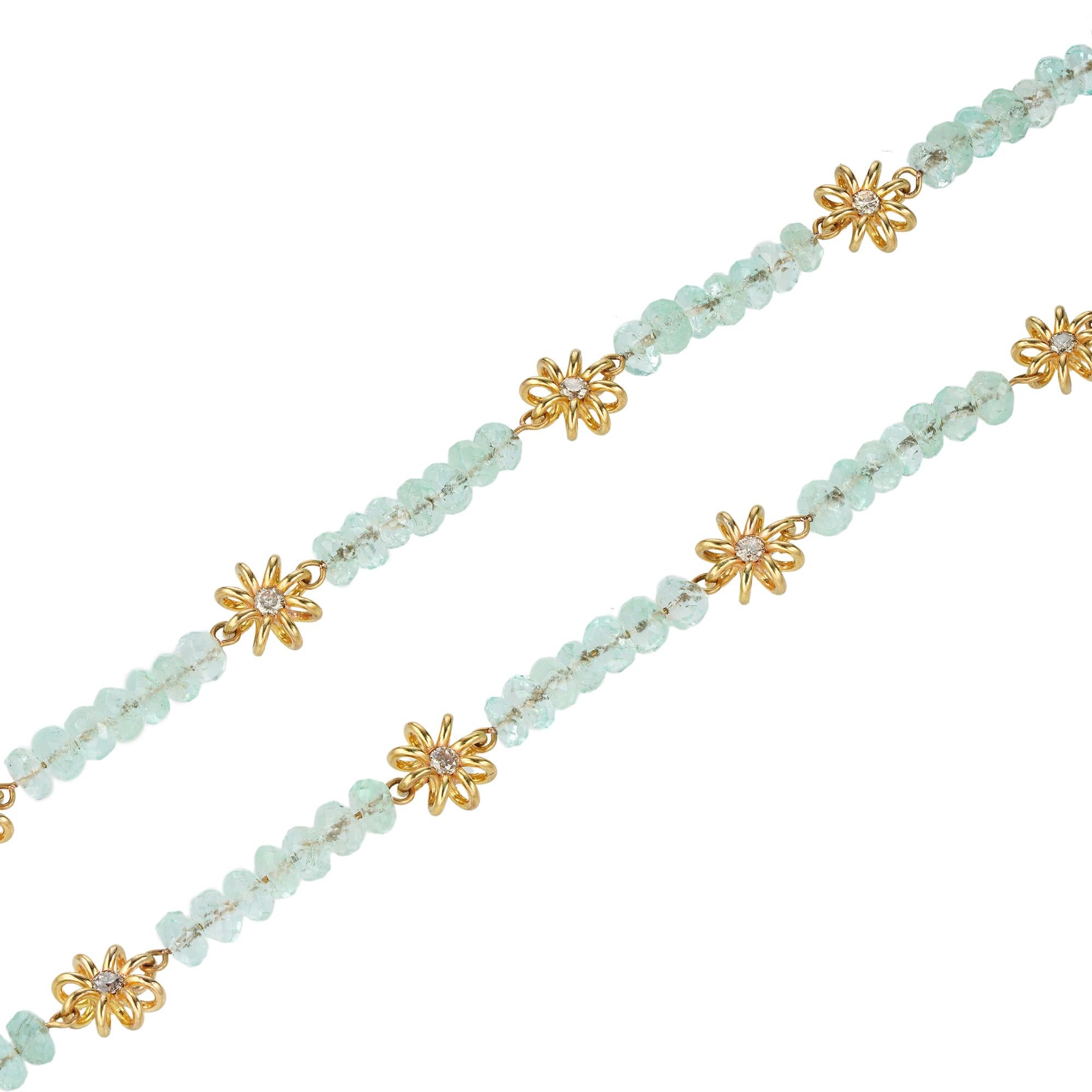 A handmade gold, diamond and green beryl necklace by Lucie Heskett-Brem the Goldweaver of Lucerne, consisting of fifteen gold flower-heads each centrally-set with a round brilliant-cut diamond, the diamonds weighing 0.59 carats in total, the